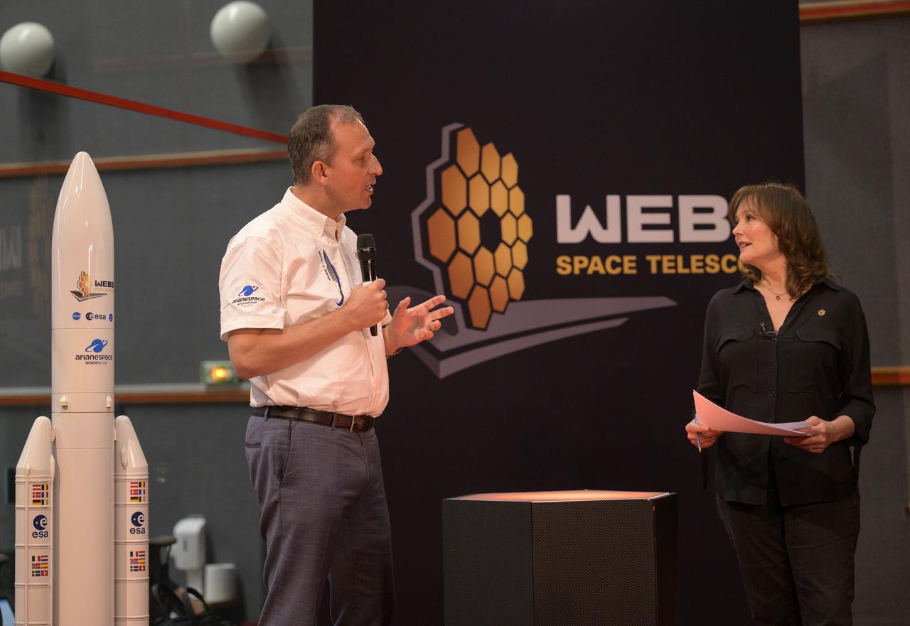 NASA Associate Administrator for the Science Mission Directorate Thomas Zurbuchen is interviewed by Katy Haswell on NASA television as he and the launch team monitor the countdown of the launch of Arianespace's Ariane 5 rocket carrying NASA’s James Webb Space Telescope, Saturday, Dec. 25, 2021, in the Jupiter Center at the Guiana Space Center in Kourou, French Guiana. The James Webb Space Telescope (sometimes called JWST or Webb) is a large infrared telescope with a 21.3 foot (6.5 meter) primary mirror. The observatory will study every phase of cosmic history—from within our solar system to the most distant observable galaxies in the early universe. Photo Credit: (NASA/Bill Ingalls)