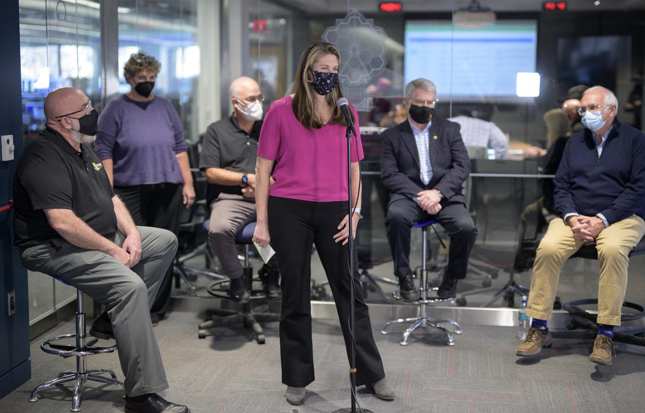 NASA Public Affairs Officer Karen Fox, center, moderates a briefing following the successful deployment of NASA’s James Webb Space Telescope primary mirror, Saturday, Jan. 8, 2022, from the Webb Space Telescope Mission Operations Center at the Space Telescope Science Institute in Baltimore. With Webb’s 21.3-foot (6.5-meter) primary mirror fully deployed, the infrared observatory has completed its unprecedented process of unfolding in space to prepare for science operations. The observatory will study every phase of cosmic history—from within our solar system to the most distant observable galaxies in the early universe. Photo Credit: (NASA/Bill Ingalls)