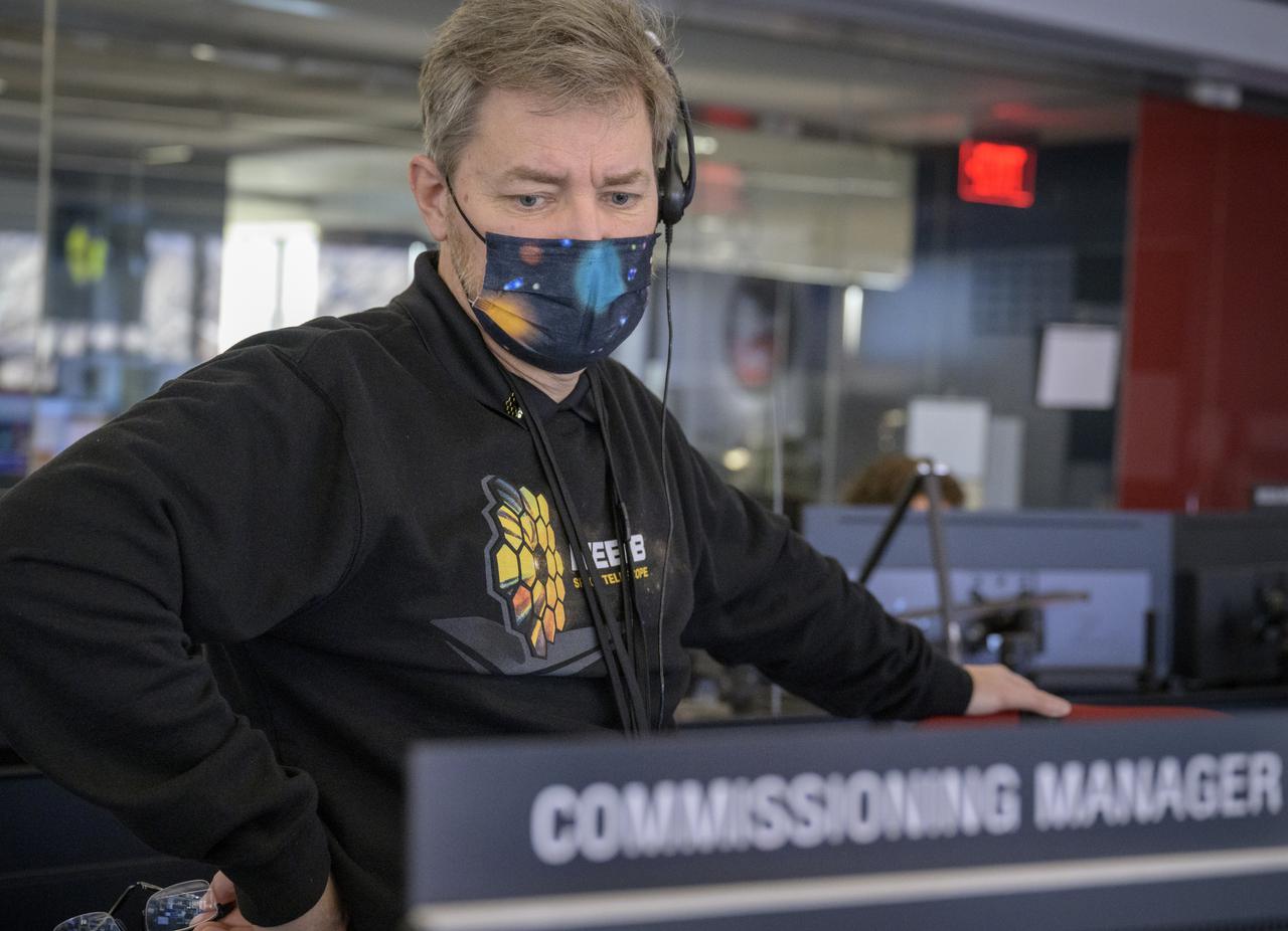 NASA James Webb Space Telescope Commissioning Manager John Durning monitors the progress of the Webb observatory as it’s second primary mirror wing is rotated into position, Saturday, Jan. 8, 2022, from NASA’s James Webb Space Telescope Mission Operations Center at the Space Telescope Science Institute in Baltimore. Webb, an infrared telescope with a 21.3-foot (6.5-meter) primary mirror, was folded up for launch and underwent an unprecedented deployment process to unfold in space. As NASA's next flagship observatory, Webb will study every phase of cosmic history—from within our solar system to the most distant observable galaxies in the early universe. Photo Credit: (NASA/Bill Ingalls)