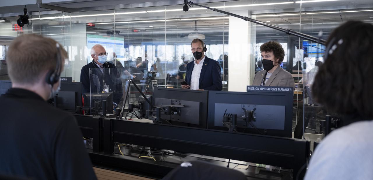 NASA Associate Administrator for the Science Mission Directorate Thomas Zurbuchen congratulates the NASA James Webb Space Telescope mission operations team after confirming that the observatory’s final primary mirror wing successfully extended and locked into place, Saturday, Jan. 8, 2022, at the Space Telescope Science Institute in Baltimore. With Webb’s 21.3-foot (6.5-meter) primary mirror fully deployed, the infrared observatory has completed its unprecedented process of unfolding in space to prepare for science operations. The observatory will study every phase of cosmic history—from within our solar system to the most distant observable galaxies in the early universe. Photo Credit: (NASA/Bill Ingalls)