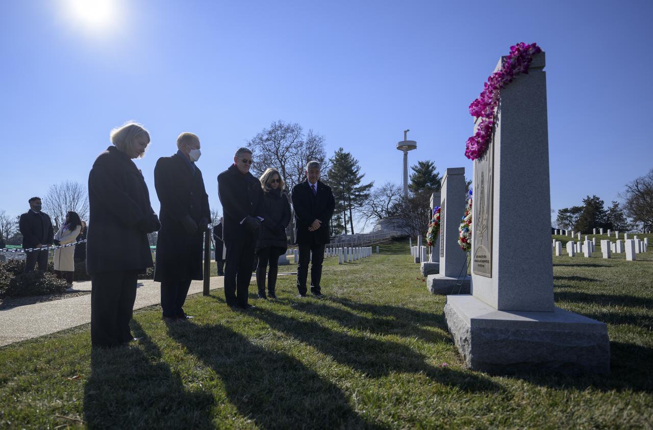 NASA Deputy Administrator Pam Melroy, left, NASA Administrator Bill Nelson, and NASA Associate Administrator Bob Cabana, along with McCool Family Representatives Jane Tani, Dan Tani, visit the Space Shuttle Columbia Memorial during a wreath laying ceremony that was part of NASA's Day of Remembrance, Thursday, Jan. 27, 2022, at Arlington National Cemetery in Arlington, Va. Wreaths were laid in memory of those men and women who lost their lives in the quest for space exploration.  Photo Credit: (NASA/Bill Ingalls)