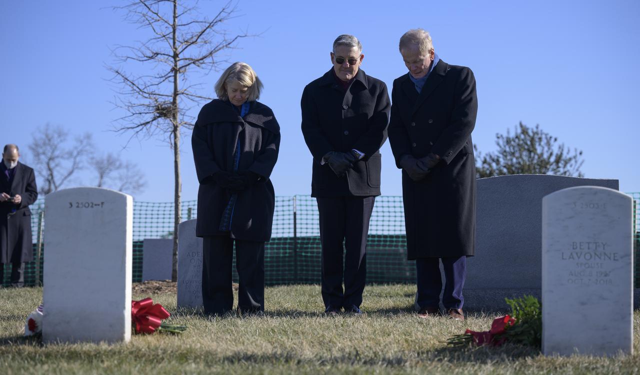 NASA Deputy Administrator Pam Melroy, left, NASA Administrator Bill Nelson, and NASA Associate Administrator Bob Cabana, right, pay respects at the grave markers of Virgil "Gus" Grissom and Roger Chaffee, from Apollo 1, during a ceremony that was part of NASA's Day of Remembrance, Thursday, Jan. 27, 2022, at Arlington National Cemetery in Arlington, Va.  Wreaths were laid in memory of those men and women who lost their lives in the quest for space exploration.  Photo Credit: (NASA/Bill Ingalls)