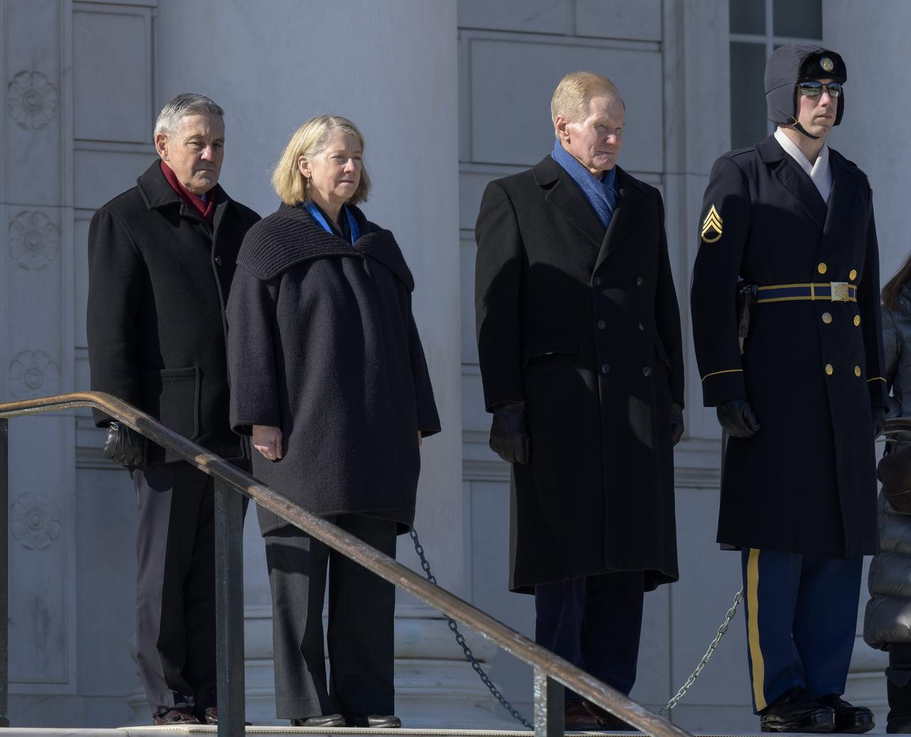 NASA Associate Administrator Bob Cabana, left, NASA Deputy Administrator Pam Melroy, and NASA Administrator Bill Nelson, prepare to be escorted to the Tomb of the Unknowns for a wreath laying as part of NASA's Day of Remembrance, Thursday, Jan. 27, 2022, at Arlington National Cemetery in Arlington, Va.  The wreaths were laid in memory of those men and women who lost their lives in the quest for space exploration.  Photo Credit: (NASA/Bill Ingalls)