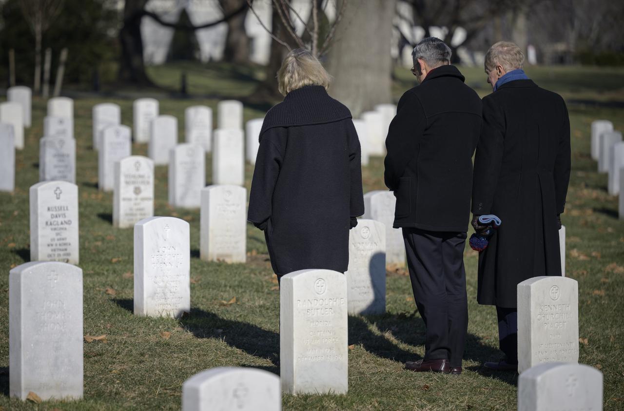 NASA Deputy Administrator Pam Melroy, left, NASA Associate Administrator Bob Cabana, and NASA Administrator Bill Nelson, right, stop at the gravesite of former astronaut and U.S. Senator John Glenn to pay their respects, Thursday, Jan. 27, 2022, at Arlington National Cemetery in Arlington, Va. Nelson, Melroy, and Cabana had earlier laid wreaths in memory of those men and women who lost their lives in the quest for space exploration as part of NASA's Day of Remembrance. Photo Credit: (NASA/Bill Ingalls)