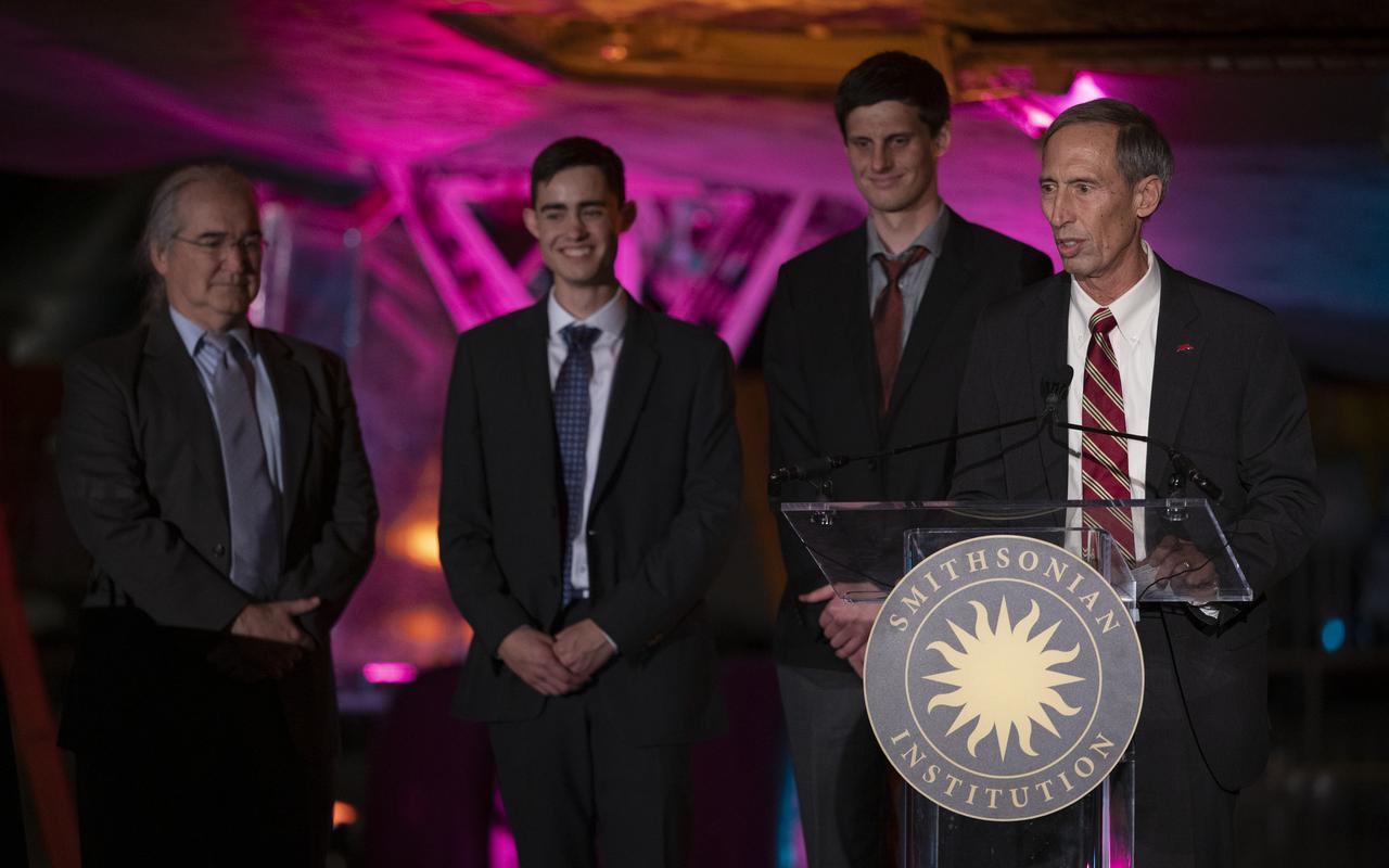 Interim director of NASA’s Jet Propulsion Laboratory Lt. Gen. Larry James, USAF (Ret.), right, delivers remarks after accepting the 2022 Michael Collins Trophy for Current Achievement on behalf of MiMi Aung and the Mars Ingenuity Helicopter Team, Thursday, March 24, 2022, at the Smithsonian National Air and Space Museum’s Steven F. Udvar-Hazy center in Chantilly, Va. Pictured with James are Dave Lavery, program executive for Solar System Exploration at NASA Headquarters, left, Joshua Anderson, Ingenuity Mars Helicopter tactical lead at NASA JPL, second from left, and Gerik Kubiak, Ingenuity Mars Helicopter flight software lead at NASA JPL, center. The Smithsonian National Air and Space Museum’s Michael Collins Trophy recognizes extraordinary accomplishments in aeronautics and spaceflight. Photo Credit: (NASA/Joel Kowsky)