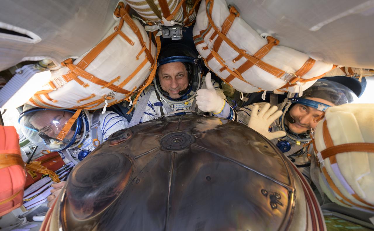 Expedition 66 crew members Mark Vande Hei of NASA, left, cosmonauts Anton Shkaplerov, center, and Pyotr Dubrov of Roscosmos, are seen inside their Soyuz MS-19 spacecraft after is landed in a remote area near the town of Zhezkazgan, Kazakhstan, Wednesday, March 30, 2022. Vande Hei and Dubrov are returning to Earth after logging 355 days in space as members of Expeditions 64-66 aboard the International Space Station. For Vande Hei, his mission is the longest single spaceflight by a U.S. astronaut in history. Shkaplerov is returning after 176 days in space, serving as a Flight Engineer for Expedition 65 and commander of Expedition 66. Photo Credit: (NASA/Bill Ingalls)