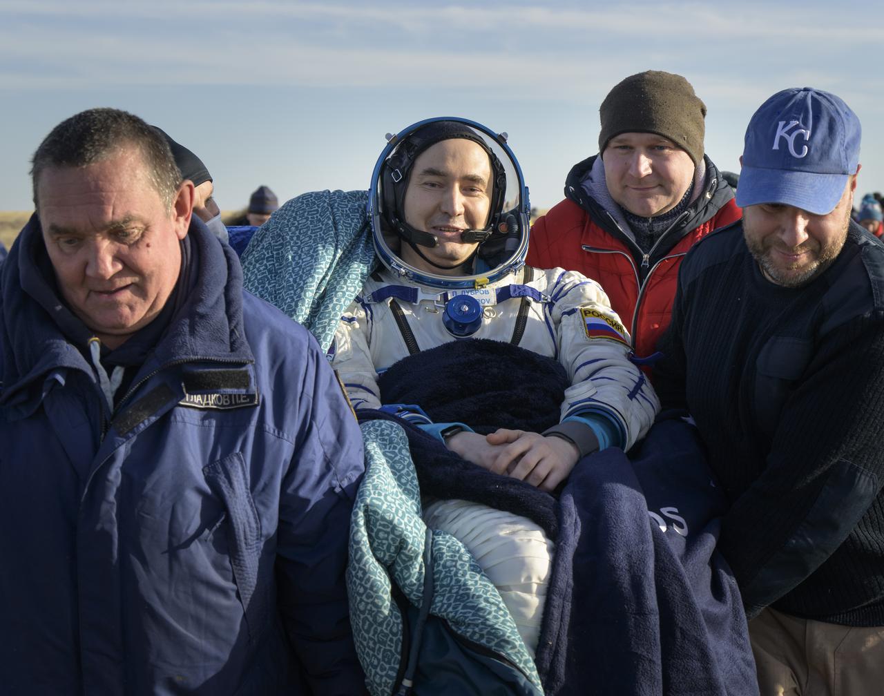 Expedition 66 Russian cosmonaut Pyotr Dubrov is carried to a medical tent shortly after he and fellow crew mates Mark Vande Hei of NASA and Anton Shkaplerov of Roscosmos landed in their Soyuz MS-19 spacecraft near the town of Zhezkazgan, Kazakhstan on Wednesday, March 30, 2022. Vande Hei and Dubrov are returning to Earth after logging 355 days in space as members of Expeditions 64-66 aboard the International Space Station. For Vande Hei, his mission is the longest single spaceflight by a U.S. astronaut in history. Shkaplerov is returning after 176 days in space, serving as a Flight Engineer for Expedition 65 and commander of Expedition 66. Photo Credit: (NASA/Bill Ingalls)