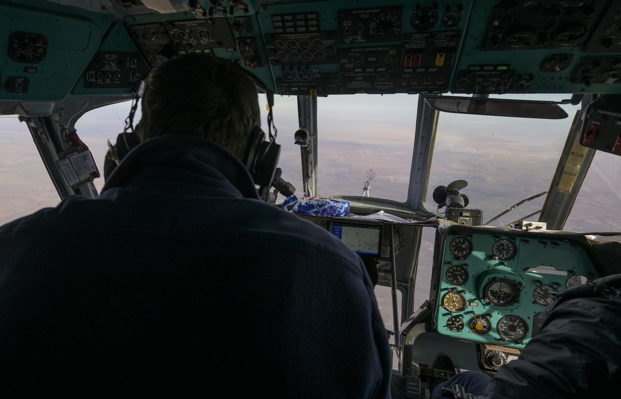 Russian Search and Rescue helicopter teams survey the sky for the Soyuz MS-19 spacecraft as it lands in a remote area near the town of Zhezkazgan, Kazakhstan with Expedition 66 crew members Mark Vande Hei of NASA, and cosmonauts Pyotr Dubrov, and Anton Shkaplerov of Roscosmos, Wednesday, March 30, 2022. Vande Hei and Dubrov are returning to Earth after logging 355 days in space as members of Expeditions 64-66 aboard the International Space Station. For Vande Hei, his mission is the longest single spaceflight by a U.S. astronaut in history. Shkaplerov is returning after 176 days in space, serving as a Flight Engineer for Expedition 65 and commander of Expedition 66. Photo Credit: (NASA/Bill Ingalls)
