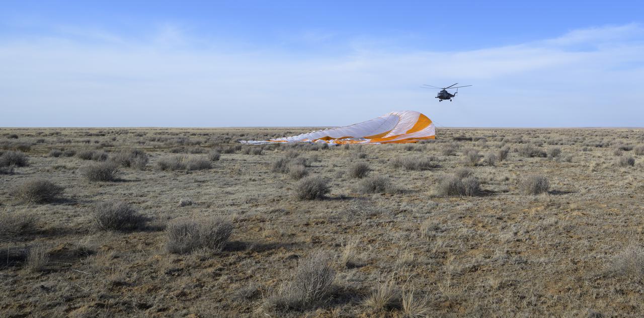 Russian Search and Rescue teams arrive at the Soyuz MS-19 spacecraft shortly after it landed in a remote area near the town of Zhezkazgan, Kazakhstan with Expedition 66 crew members Mark Vande Hei of NASA, and cosmonauts Pyotr Dubrov, and Anton Shkaplerov of Roscosmos, Wednesday, March 30, 2022. Vande Hei and Dubrov are returning to Earth after logging 355 days in space as members of Expeditions 64-66 aboard the International Space Station. For Vande Hei, his mission is the longest single spaceflight by a U.S. astronaut in history. Shkaplerov is returning after 176 days in space, serving as a Flight Engineer for Expedition 65 and commander of Expedition 66. Photo Credit: (NASA/Bill Ingalls)