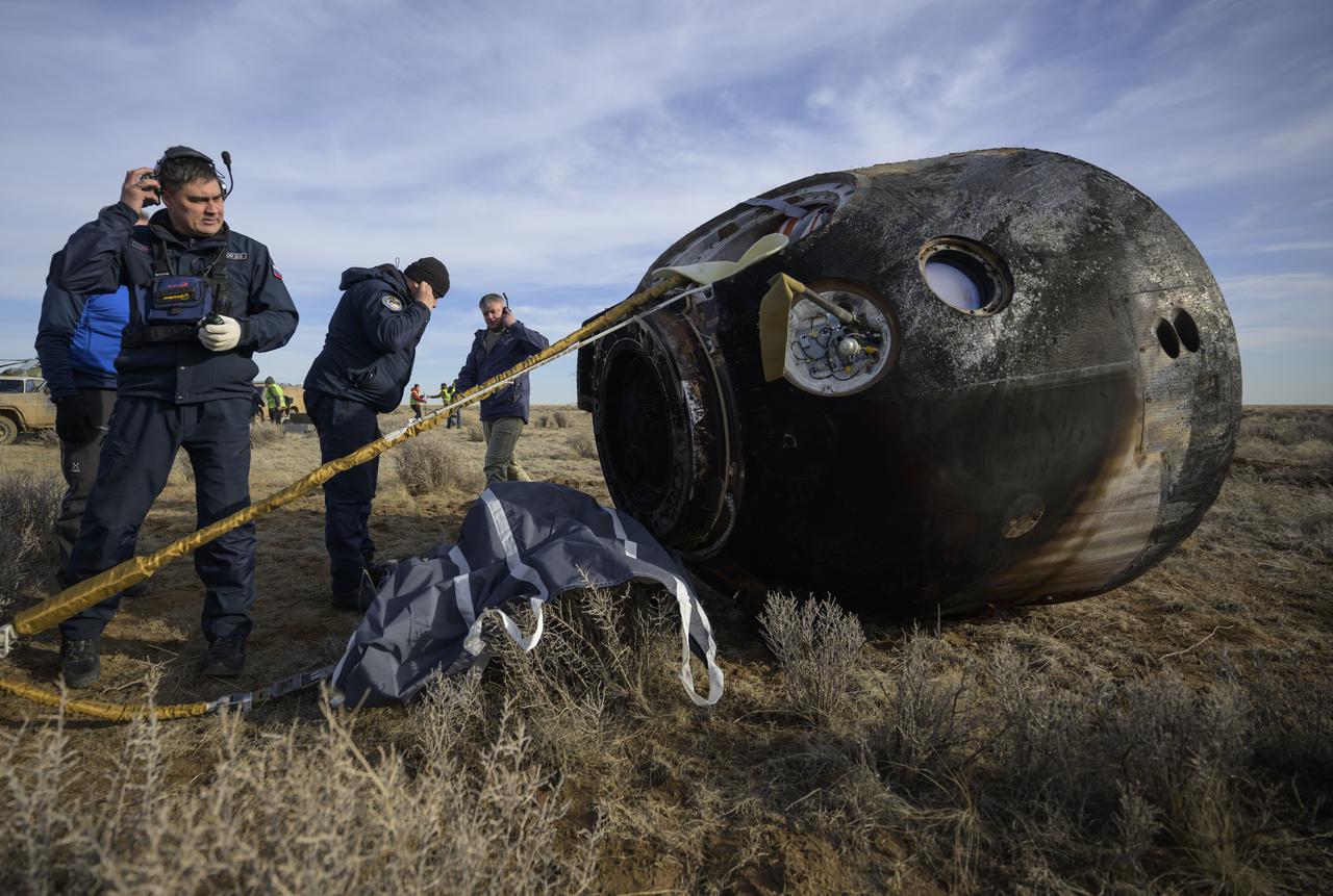 Russian Search and Rescue teams arrive at the Soyuz MS-19 spacecraft shortly after it landed in a remote area near the town of Zhezkazgan, Kazakhstan with Expedition 66 crew members Mark Vande Hei of NASA, and cosmonauts Pyotr Dubrov, and Anton Shkaplerov of Roscosmos, Wednesday, March 30, 2022. Vande Hei and Dubrov are returning to Earth after logging 355 days in space as members of Expeditions 64-66 aboard the International Space Station. For Vande Hei, his mission is the longest single spaceflight by a U.S. astronaut in history. Shkaplerov is returning after 176 days in space, serving as a Flight Engineer for Expedition 65 and commander of Expedition 66. Photo Credit: (NASA/Bill Ingalls)