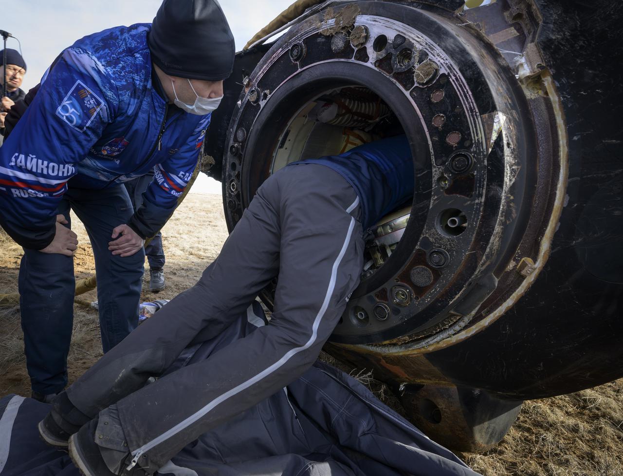 Russian Search and Rescue teams arrive at the Soyuz MS-19 spacecraft shortly after it landed in a remote area near the town of Zhezkazgan, Kazakhstan with Expedition 66 crew members Mark Vande Hei of NASA, and cosmonauts Pyotr Dubrov, and Anton Shkaplerov of Roscosmos, Wednesday, March 30, 2022. Vande Hei and Dubrov are returning to Earth after logging 355 days in space as members of Expeditions 64-66 aboard the International Space Station. For Vande Hei, his mission is the longest single spaceflight by a U.S. astronaut in history. Shkaplerov is returning after 176 days in space, serving as a Flight Engineer for Expedition 65 and commander of Expedition 66. Photo Credit: (NASA/Bill Ingalls)