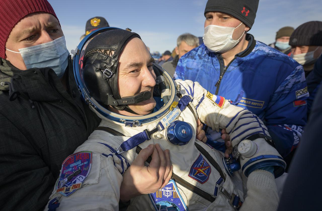 Expedition 66 Russian cosmonaut Pyotr Dubrov is helped out of the Soyuz MS-19 spacecraft just minutes after he, Russian cosmonaut Anton Shkaplerov and NASA astronaut Mark Vande Hei, landed in a remote area near the town of Zhezkazgan, Kazakhstan on Wednesday, March 30, 2022. Vande Hei and Dubrov are returning to Earth after logging 355 days in space as members of Expeditions 64-66 aboard the International Space Station. For Vande Hei, his mission is the longest single spaceflight by a U.S. astronaut in history. Shkaplerov is returning after 176 days in space, serving as a Flight Engineer for Expedition 65 and commander of Expedition 66. Photo Credit: (NASA/Bill Ingalls)