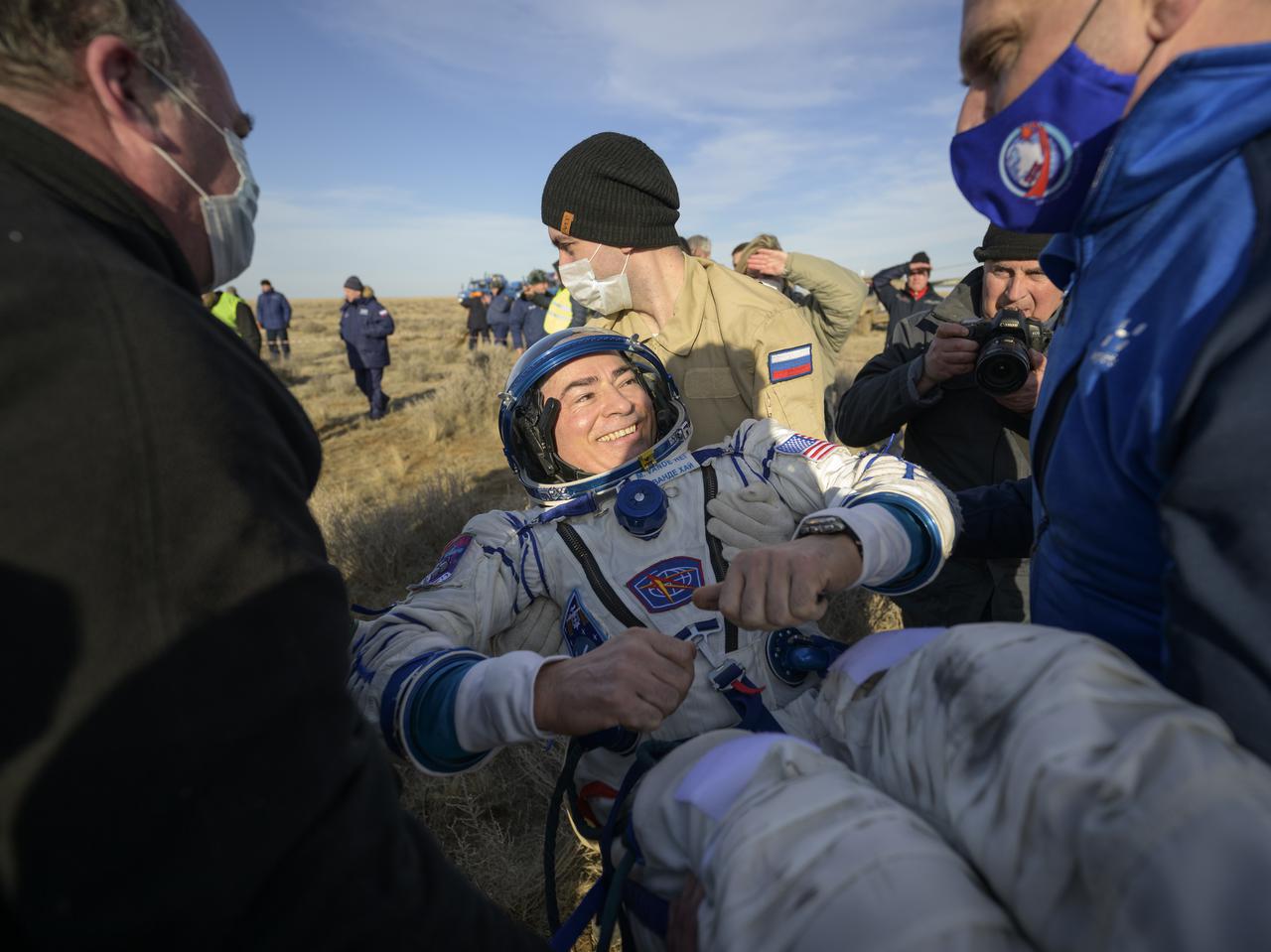 Expedition 66 NASA astronaut Mark Vande Hei is helped out of the Soyuz MS-19 spacecraft just minutes after he and Russian cosmonauts Pyotr Dubrov and Anton Shkaplerov, landed in a remote area near the town of Zhezkazgan, Kazakhstan on Wednesday, March 30, 2022. Vande Hei and Dubrov are returning to Earth after logging 355 days in space as members of Expeditions 64-66 aboard the International Space Station. For Vande Hei, his mission is the longest single spaceflight by a U.S. astronaut in history. Shkaplerov is returning after 176 days in space, serving as a Flight Engineer for Expedition 65 and commander of Expedition 66. Photo Credit: (NASA/Bill Ingalls)