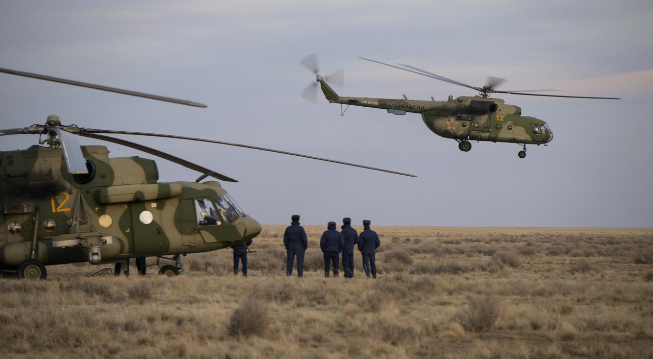 Russian support personnel start to depart the Soyuz MS-19 spacecraft landing site shortly after it landed in a remote area near the town of Zhezkazgan, Kazakhstan with Expedition 64 crew members Mark Vande Hei of NASA, and cosmonauts Pyotr Dubrov, and Anton Shkaplerov of Roscosmos, Wednesday, March 30, 2022. Vande Hei and Dubrov are returning to Earth after logging 355 days in space as members of Expeditions 64-66 aboard the International Space Station. For Vande Hei, his mission is the longest single spaceflight by a U.S. astronaut in history. Shkaplerov is returning after 176 days in space, serving as a Flight Engineer for Expedition 65 and commander of Expedition 66. Photo Credit: (NASA/Bill Ingalls)