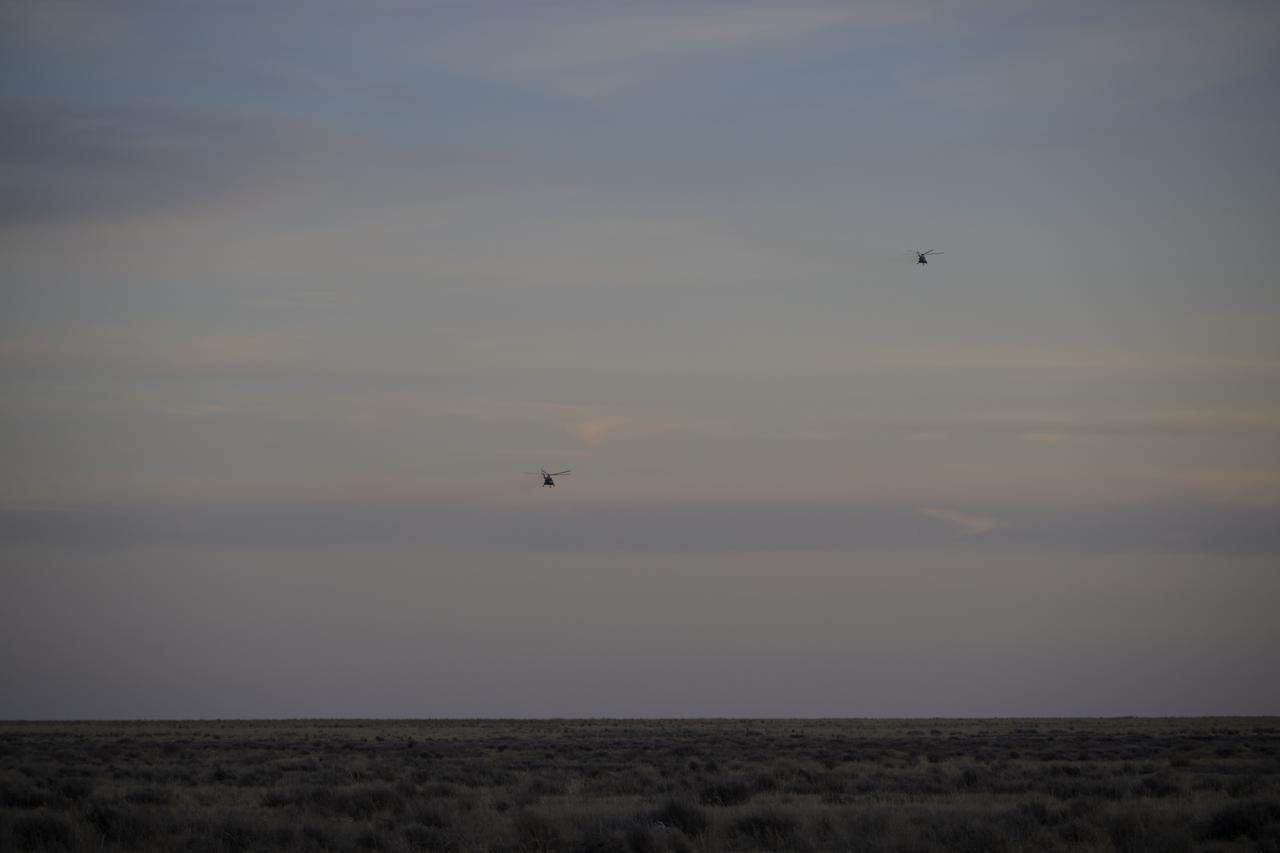 Russian support personnel start to depart the Soyuz MS-19 spacecraft landing site shortly after it landed in a remote area near the town of Zhezkazgan, Kazakhstan with Expedition 64 crew members Mark Vande Hei of NASA, and cosmonauts Pyotr Dubrov, and Anton Shkaplerov of Roscosmos, Wednesday, March 30, 2022. Vande Hei and Dubrov are returning to Earth after logging 355 days in space as members of Expeditions 64-66 aboard the International Space Station. For Vande Hei, his mission is the longest single spaceflight by a U.S. astronaut in history. Shkaplerov is returning after 176 days in space, serving as a Flight Engineer for Expedition 65 and commander of Expedition 66. Photo Credit: (NASA/Bill Ingalls)