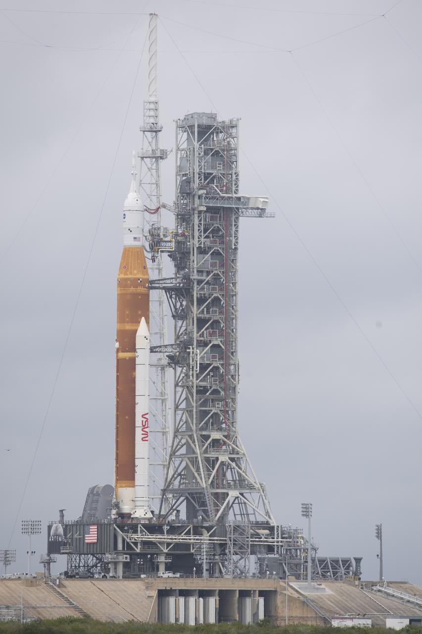 NASA’s Space Launch System (SLS) rocket with the Orion spacecraft aboard is seen atop a mobile launcher at Launch Complex 39B, Saturday, April 2, 2022, as the Artemis I launch team conducts the wet dress rehearsal test at NASA’s Kennedy Space Center in Florida. Ahead of NASA’s Artemis I flight test, the wet dress rehearsal will run the Artemis I launch team through operations to load propellant, conduct a full launch countdown, demonstrate the ability to recycle the countdown clock, and drain the tanks to practice timelines and procedures for launch.  Photo Credit: (NASA/Joel Kowsky)