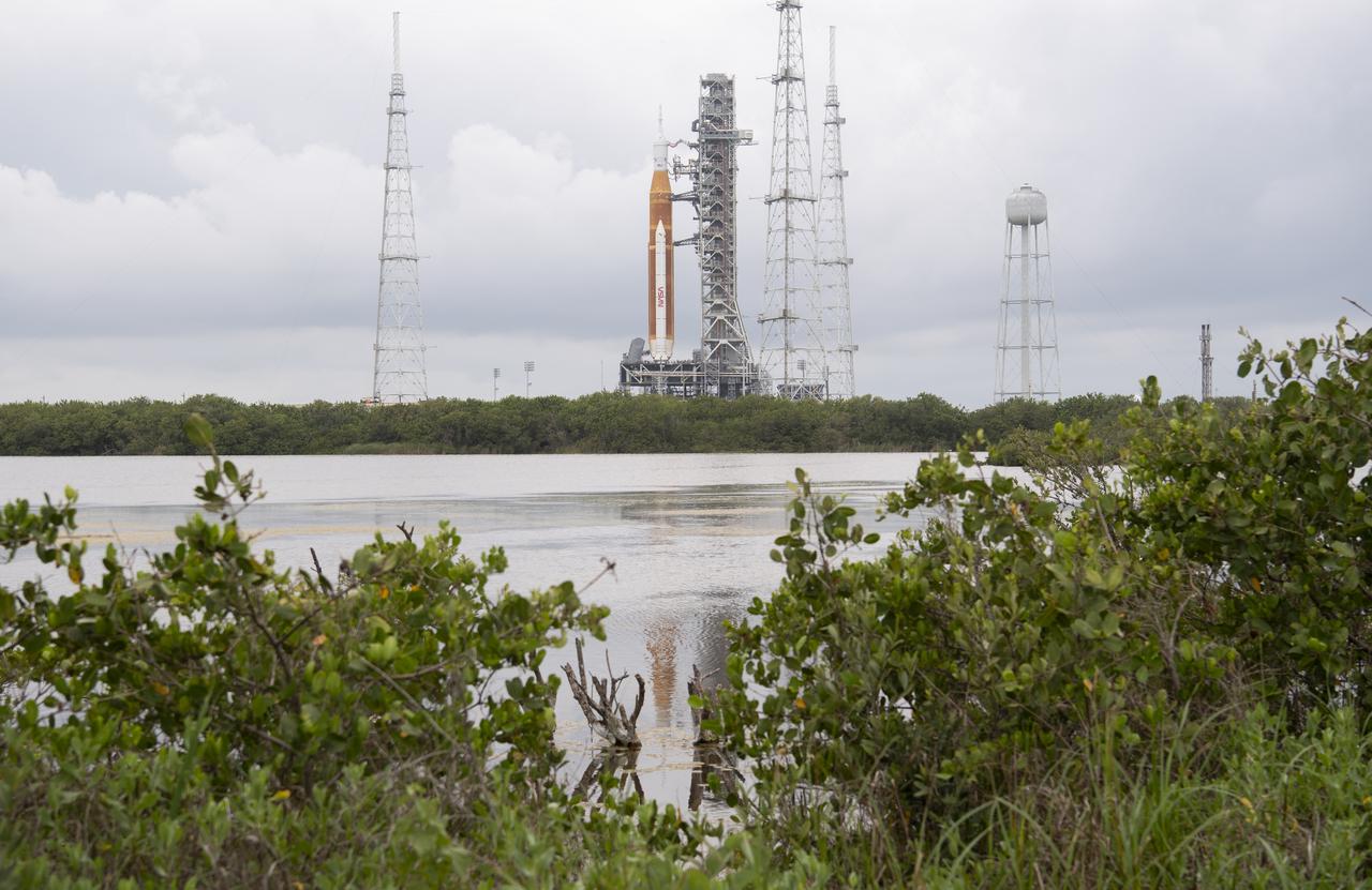 NASA’s Space Launch System (SLS) rocket with the Orion spacecraft aboard is seen atop a mobile launcher at Launch Complex 39B, Saturday, April 2, 2022, as the Artemis I launch team conducts the wet dress rehearsal test at NASA’s Kennedy Space Center in Florida. Ahead of NASA’s Artemis I flight test, the wet dress rehearsal will run the Artemis I launch team through operations to load propellant, conduct a full launch countdown, demonstrate the ability to recycle the countdown clock, and drain the tanks to practice timelines and procedures for launch.  Photo Credit: (NASA/Joel Kowsky)