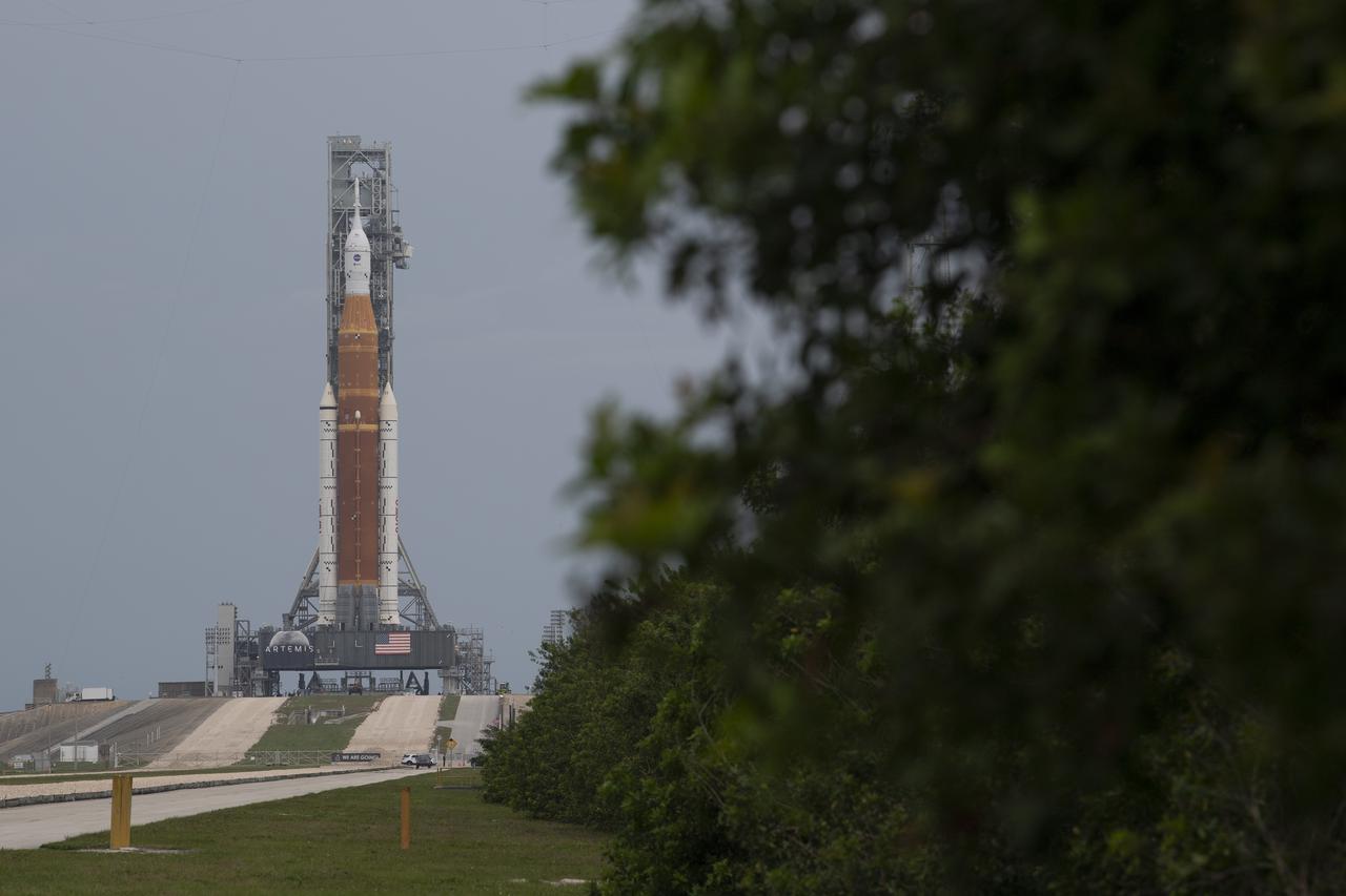 NASA’s Space Launch System (SLS) rocket with the Orion spacecraft aboard is seen atop a mobile launcher at Launch Complex 39B, Saturday, April 2, 2022, as the Artemis I launch team conducts the wet dress rehearsal test at NASA’s Kennedy Space Center in Florida. Ahead of NASA’s Artemis I flight test, the wet dress rehearsal will run the Artemis I launch team through operations to load propellant, conduct a full launch countdown, demonstrate the ability to recycle the countdown clock, and drain the tanks to practice timelines and procedures for launch.  Photo Credit: (NASA/Joel Kowsky)