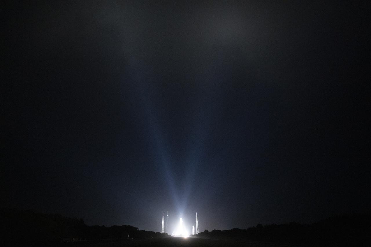 NASA’s Space Launch System (SLS) rocket with the Orion spacecraft aboard is seen atop a mobile launcher at Launch Complex 39B illuminated by spotlights, Saturday, April 2, 2022, as the Artemis I launch team conducts the wet dress rehearsal test at NASA’s Kennedy Space Center in Florida. Ahead of NASA’s Artemis I flight test, the wet dress rehearsal will run the Artemis I launch team through operations to load propellant, conduct a full launch countdown, demonstrate the ability to recycle the countdown clock, and drain the tanks to practice timelines and procedures for launch.  Photo Credit: (NASA/Joel Kowsky)