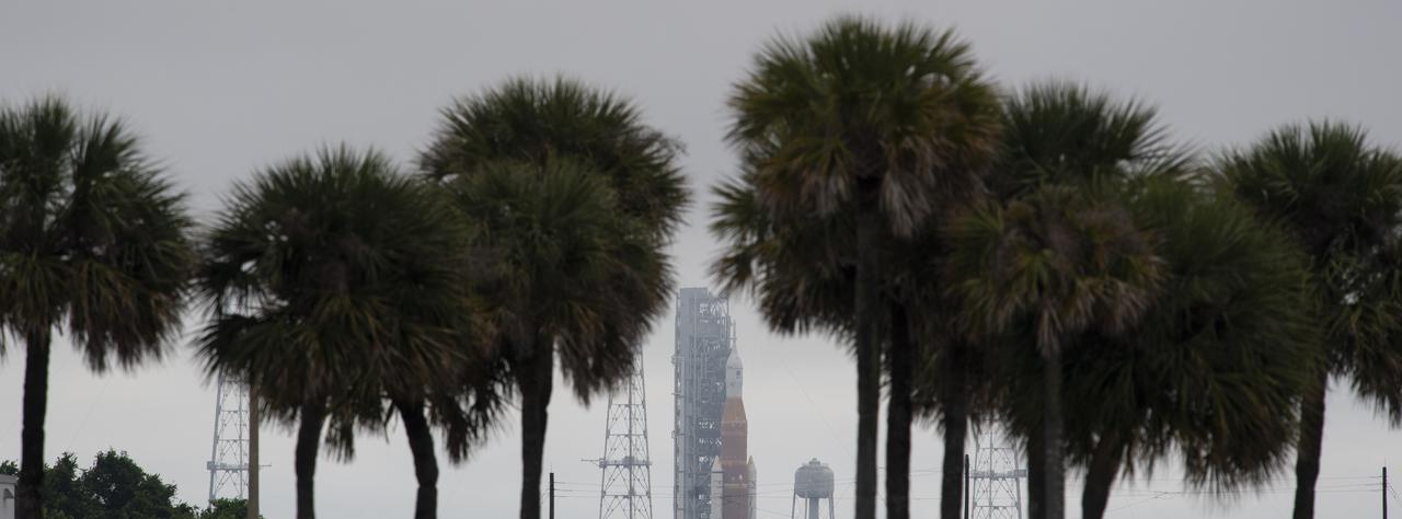 NASA’s Space Launch System (SLS) rocket with the Orion spacecraft aboard is seen atop a mobile launcher at Launch Complex 39B, Sunday, April 3, 2022, as the Artemis I launch team conducts the wet dress rehearsal test at NASA’s Kennedy Space Center in Florida. Ahead of NASA’s Artemis I flight test, the wet dress rehearsal will run the Artemis I launch team through operations to load propellant, conduct a full launch countdown, demonstrate the ability to recycle the countdown clock, and drain the tanks to practice timelines and procedures for launch.  Photo Credit: (NASA/Joel Kowsky)