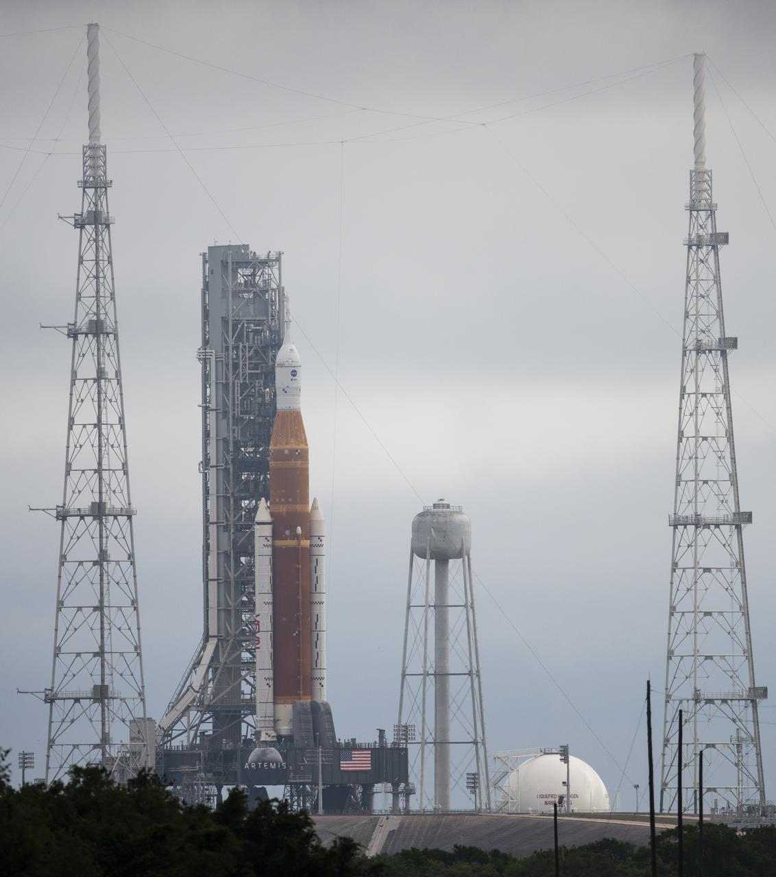NASA’s Space Launch System (SLS) rocket with the Orion spacecraft aboard is seen atop a mobile launcher at Launch Complex 39B, Sunday, April 3, 2022, as the Artemis I launch team conducts the wet dress rehearsal test at NASA’s Kennedy Space Center in Florida. Ahead of NASA’s Artemis I flight test, the wet dress rehearsal will run the Artemis I launch team through operations to load propellant, conduct a full launch countdown, demonstrate the ability to recycle the countdown clock, and drain the tanks to practice timelines and procedures for launch.  Photo Credit: (NASA/Joel Kowsky)