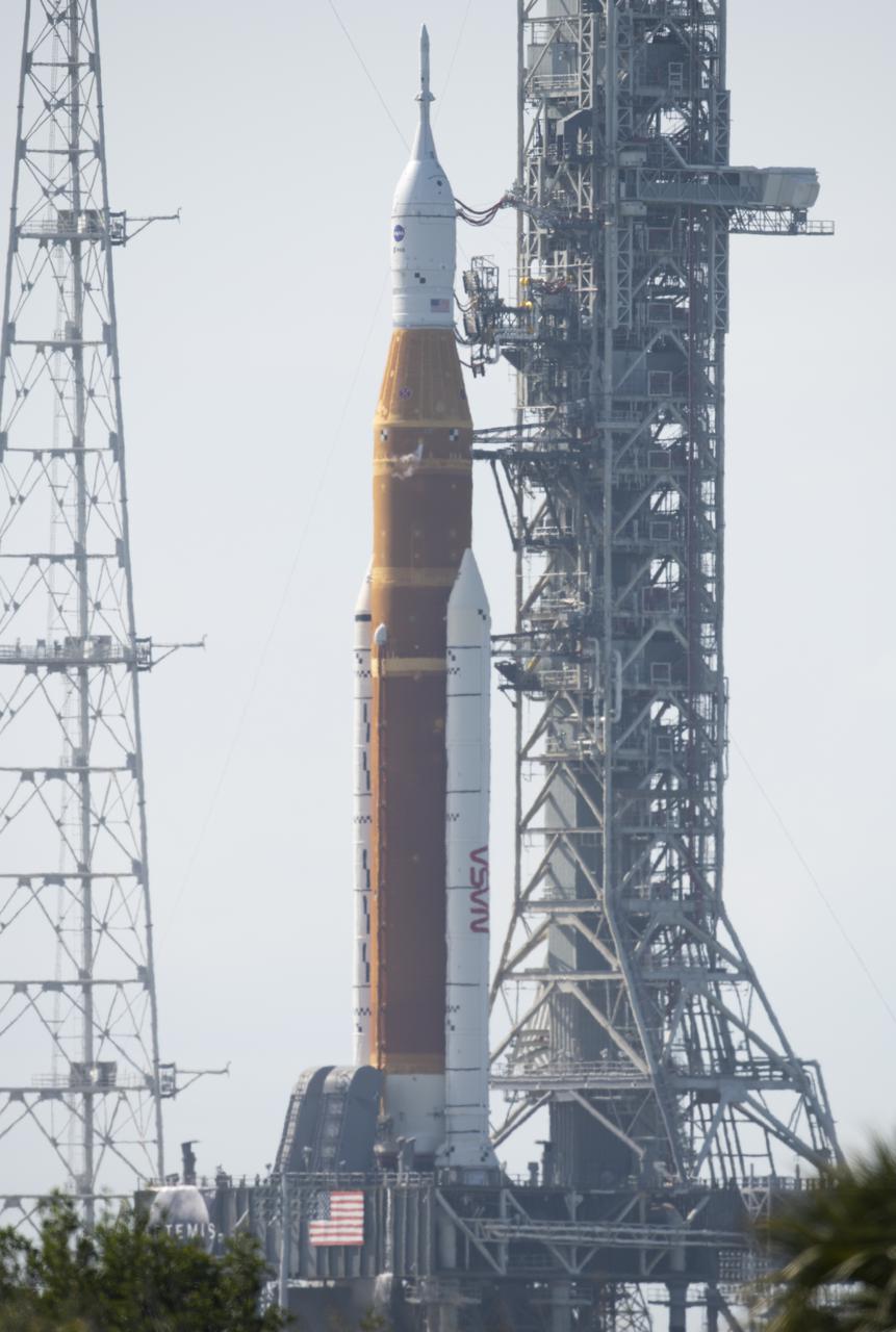 NASA’s Space Launch System (SLS) rocket with the Orion spacecraft aboard is seen atop a mobile launcher at Launch Complex 39B, Monday, April 4, 2022, as the Artemis I launch teams load more than 700,000 gallons of cryogenic propellants including liquid hydrogen and liquid oxygen during the wet dress rehearsal test at NASA’s Kennedy Space Center in Florida. Ahead of NASA’s Artemis I flight test, the wet dress rehearsal will run the Artemis I launch team through operations to load propellant, conduct a full launch countdown, demonstrate the ability to recycle the countdown clock, and drain the tanks to practice timelines and procedures for launch.  Photo Credit: (NASA/Joel Kowsky)