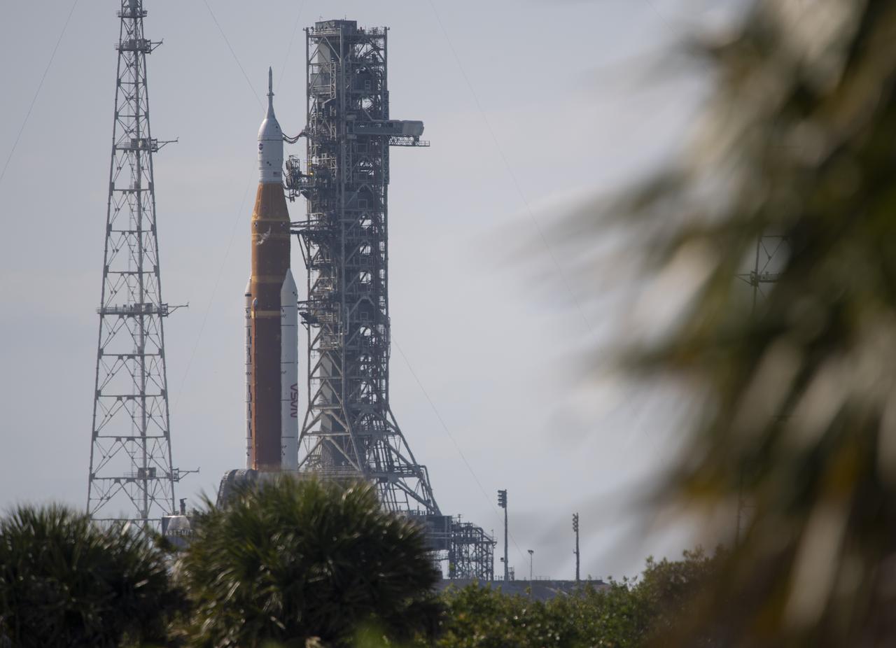 NASA’s Space Launch System (SLS) rocket with the Orion spacecraft aboard is seen atop a mobile launcher at Launch Complex 39B, Monday, April 4, 2022, as the Artemis I launch team conducts the wet dress rehearsal test at NASA’s Kennedy Space Center in Florida. Ahead of NASA’s Artemis I flight test, the wet dress rehearsal will run the Artemis I launch team through operations to load propellant, conduct a full launch countdown, demonstrate the ability to recycle the countdown clock, and drain the tanks to practice timelines and procedures for launch.  Photo Credit: (NASA/Joel Kowsky)
