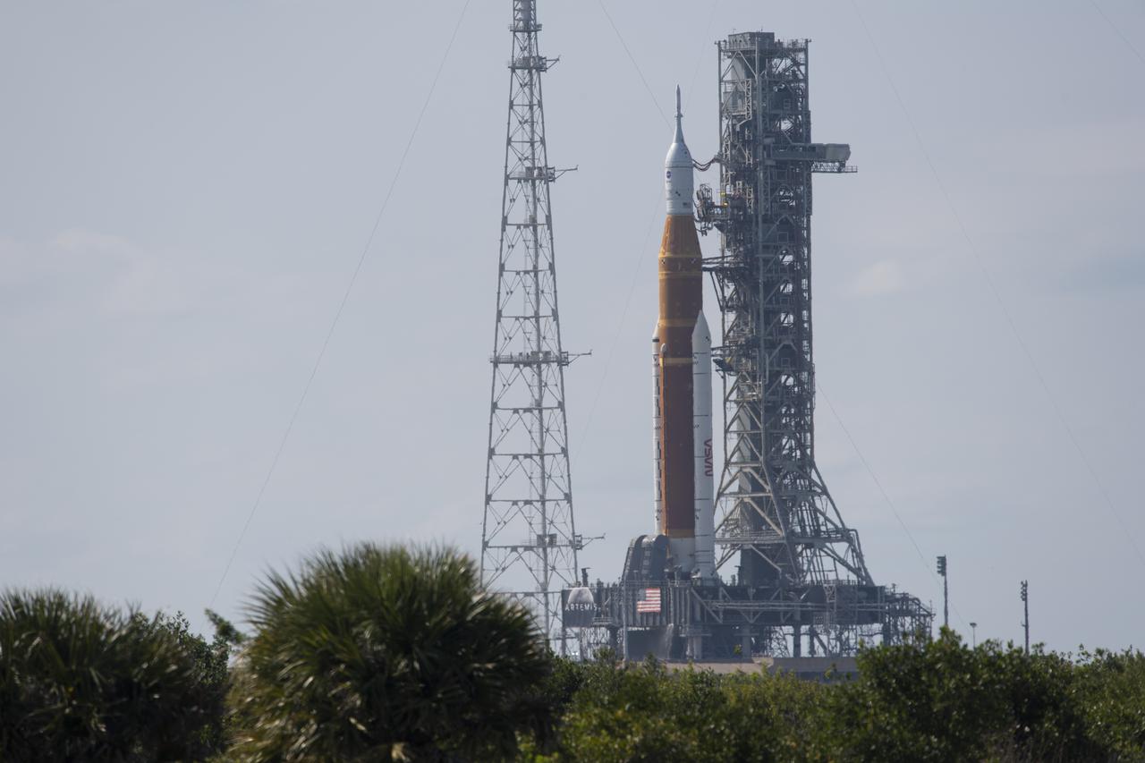 NASA’s Space Launch System (SLS) rocket with the Orion spacecraft aboard is seen atop a mobile launcher at Launch Complex 39B, Monday, April 4, 2022, as the Artemis I launch team conducts the wet dress rehearsal test at NASA’s Kennedy Space Center in Florida. Ahead of NASA’s Artemis I flight test, the wet dress rehearsal will run the Artemis I launch team through operations to load propellant, conduct a full launch countdown, demonstrate the ability to recycle the countdown clock, and drain the tanks to practice timelines and procedures for launch.  Photo Credit: (NASA/Joel Kowsky)