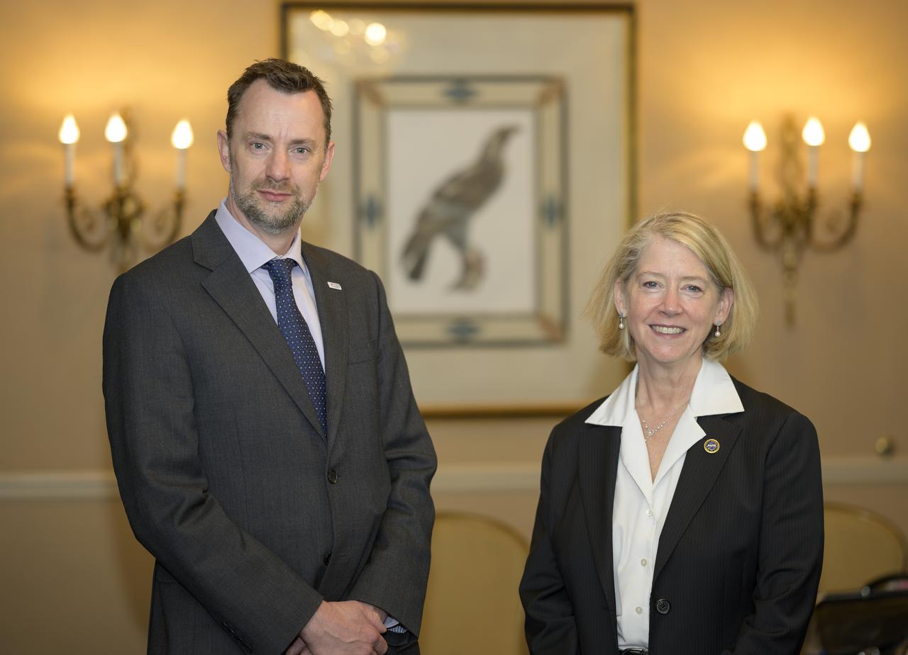 Dr. Paul Bate, Chief Executive Officer UK Space Agency (UKSA), left, and NASA Deputy Administrator Pam Melroy, pose for a photograph prior to starting at meeting during the 37th Space Symposium, Tuesday, April 5, 2022, in Colorado Springs, Colorado. Photo Credit: (NASA/Bill Ingalls)