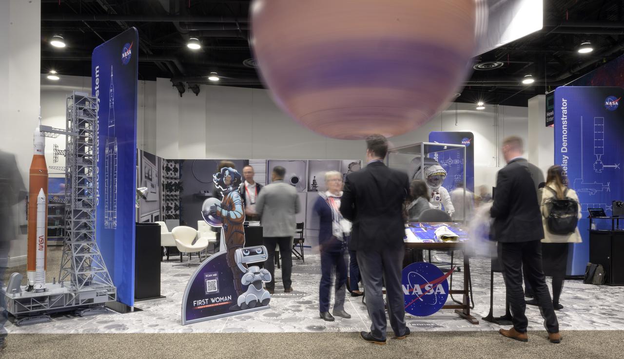 The NASA Exhibit area is seen in this 6 second exposure photograph during the 37th Space Symposium, Tuesday, April 5, 2022, in Colorado Springs, Colorado. Photo Credit: (NASA/Bill Ingalls)