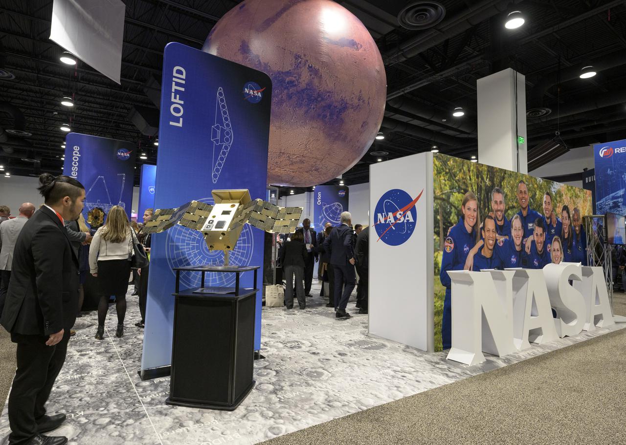 Attendees visit the NASA Exhibit area during the 37th Space Symposium, Tuesday, April 5, 2022, in Colorado Springs, Colorado. Photo Credit: (NASA/Bill Ingalls)