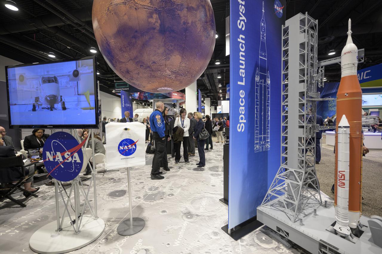 NASA Deputy Administrator Pam Melroy meets with colleagues at the NASA Exhibit area during the 37th Space Symposium, Wednesday, April 6, 2022, in Colorado Springs, Colorado. Photo Credit: (NASA/Bill Ingalls)