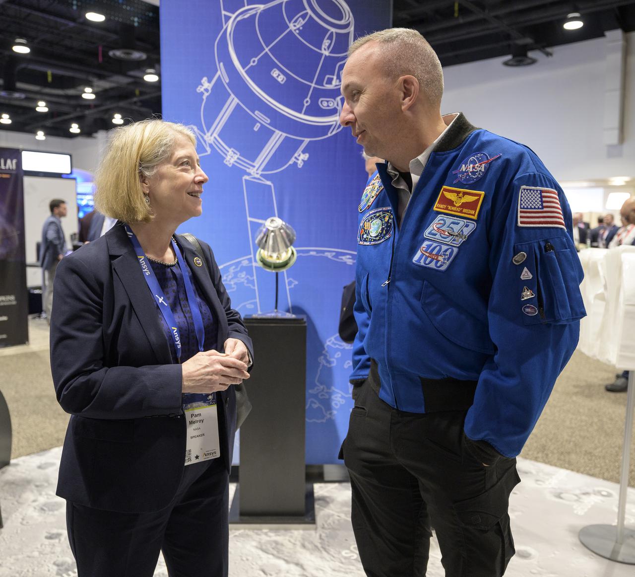 NASA Deputy Administrator Pam Melroy talks with NASA astronaut Randy Bresnik at the NASA Exhibit area during the 37th Space Symposium, Wednesday, April 6, 2022, in Colorado Springs, Colorado. Photo Credit: (NASA/Bill Ingalls)