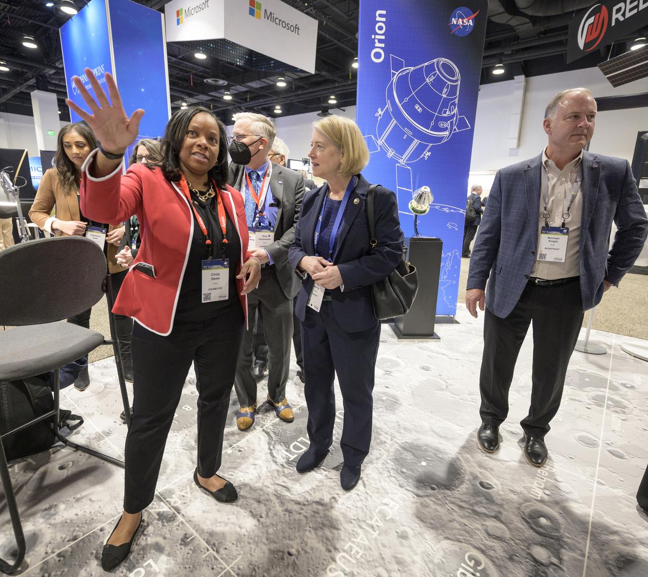 Cindy Steele from NASA Headquarters Communications shows NASA Deputy Administrator Pam Melroy the NASA Exhibit area during the 37th Space Symposium, Wednesday, April 6, 2022, in Colorado Springs, Colorado. Photo Credit: (NASA/Bill Ingalls)