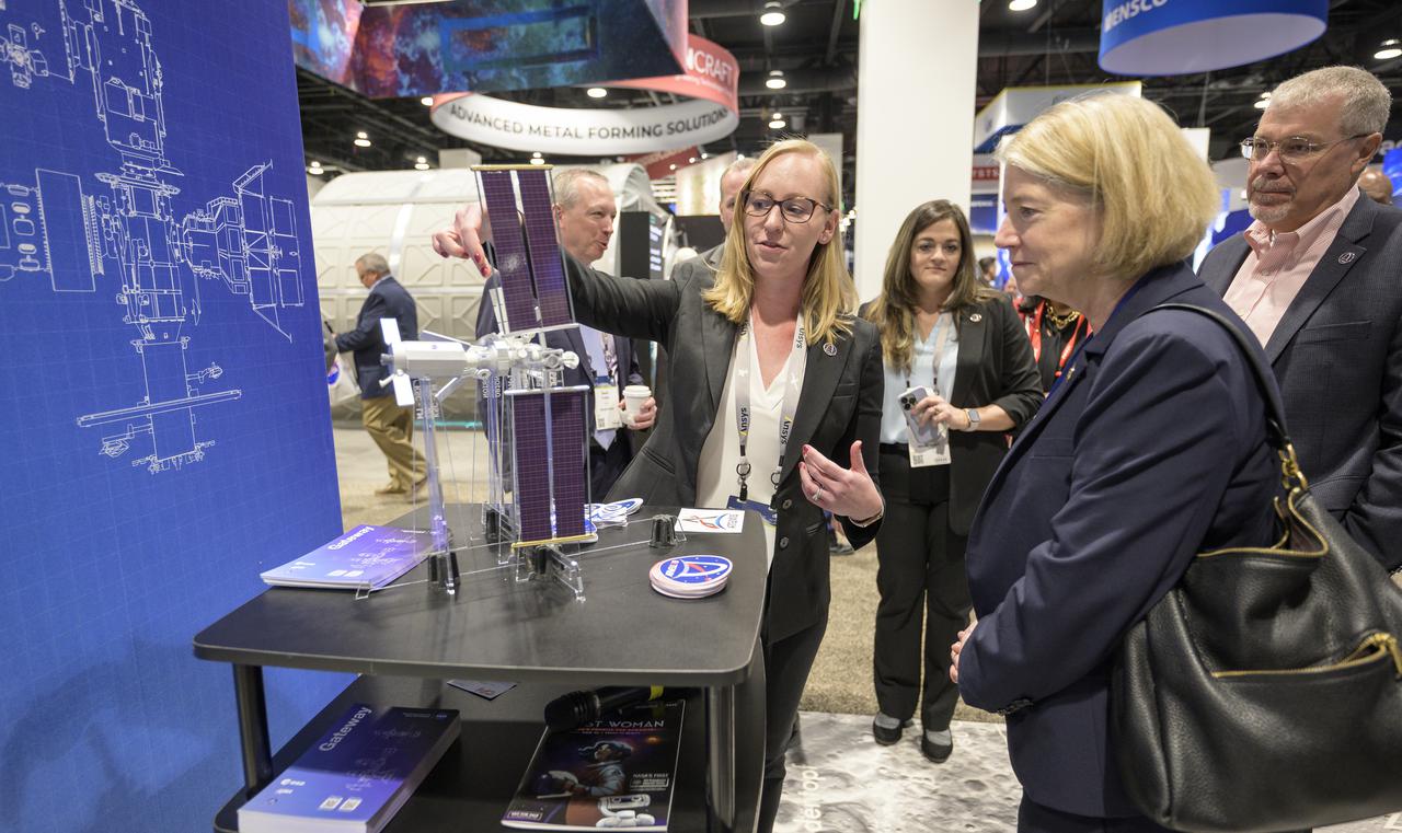 NASA Deputy Administrator Pam Melroy, right, meets with colleagues at the NASA Exhibit area during the 37th Space Symposium, Wednesday, April 6, 2022, in Colorado Springs, Colorado. Photo Credit: (NASA/Bill Ingalls)