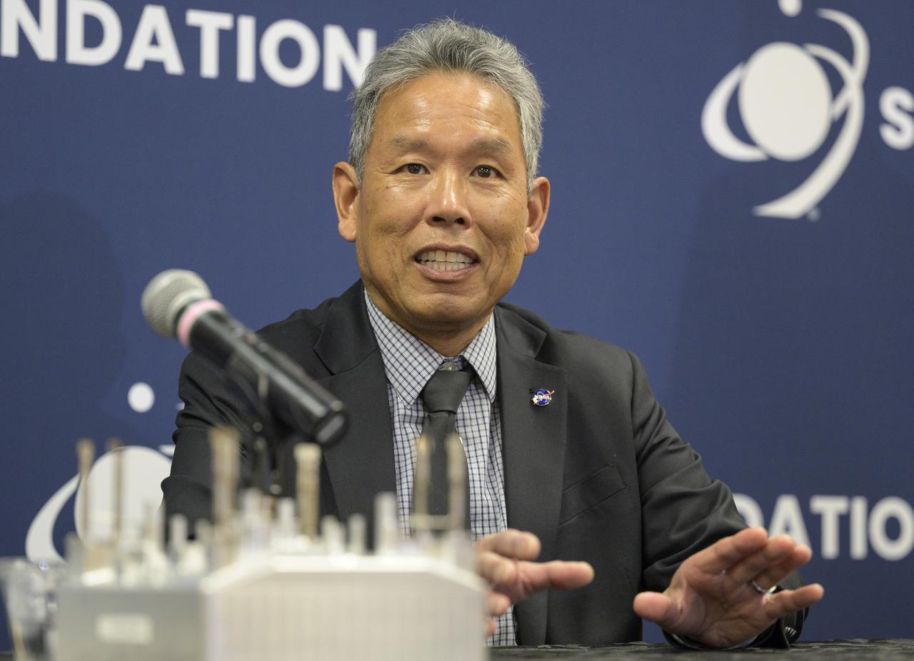 Elwood Agasid, deputy program manager for Small Spacecraft Technology at Ames Research Center and Space Technology Hall of Fame inductee speaks at “Small Satellites, Big Missions: Pathfinding CubeSats Exploring the Moon and Beyond,” a news conference during the 37th Space Symposium, Wednesday, April 6, 2022, in Colorado Springs, Colorado. Photo Credit: (NASA/Bill Ingalls)