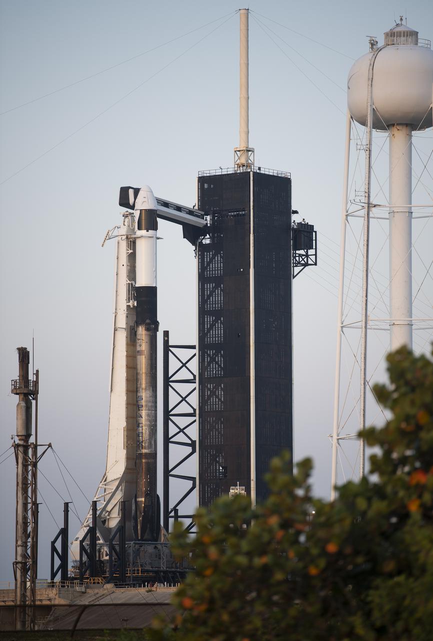 A SpaceX Falcon 9 rocket with the company's Crew Dragon spacecraft aboard is seen at sunrise on the launch pad at Launch Complex 39A as preparations continue for Axiom Mission 1 (Ax-1), Thursday, April 7, 2022, at NASA’s Kennedy Space Center in Florida. The Ax-1 mission is the first private astronaut mission to the International Space Station.  Ax-1 crew members Commander Michael López-Alegría of Spain and the United States, Pilot Larry Connor of the United States, and Mission Specialists Eytan Stibbe of Israel, and Mark Pathy of Canada are scheduled to launch on April 8 at 11:17 a.m. EDT, from Launch Complex 39A at the Kennedy Space Center. Photo Credit: (NASA/Joel Kowsky)