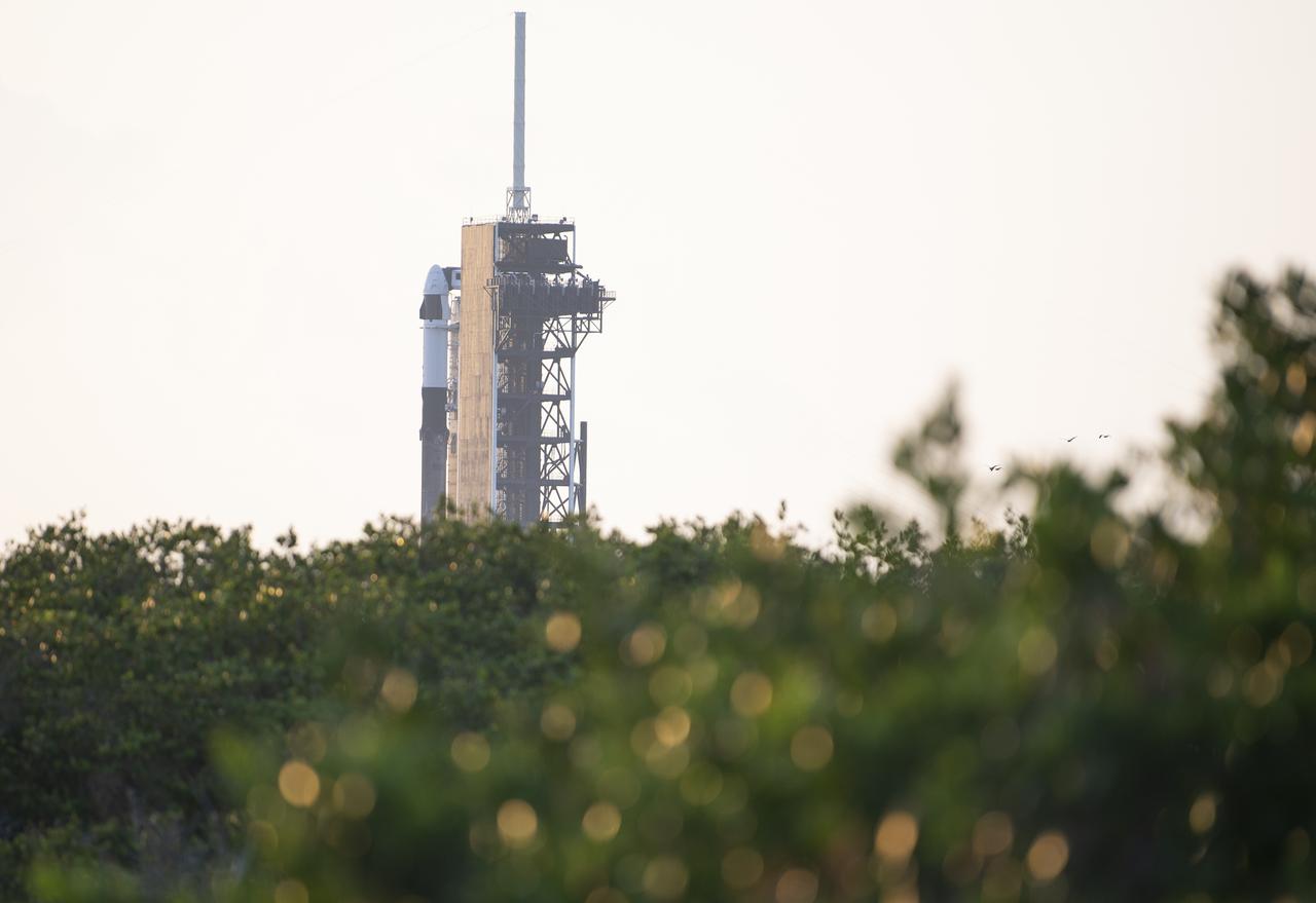 A SpaceX Falcon 9 rocket with the company's Crew Dragon spacecraft aboard is seen at sunrise on the launch pad at Launch Complex 39A as preparations continue for Axiom Mission 1 (Ax-1), Thursday, April 7, 2022, at NASA’s Kennedy Space Center in Florida. The Ax-1 mission is the first private astronaut mission to the International Space Station.  Ax-1 crew members Commander Michael López-Alegría of Spain and the United States, Pilot Larry Connor of the United States, and Mission Specialists Eytan Stibbe of Israel, and Mark Pathy of Canada are scheduled to launch on April 8 at 11:17 a.m. EDT, from Launch Complex 39A at the Kennedy Space Center. Photo Credit: (NASA/Joel Kowsky)