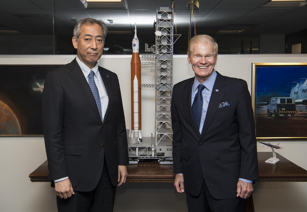 President of the Japan Aerospace Exploration Agency (JAXA), Hiroshi Yamakawa, left, and NASA Administrator Bill Nelson, pose for a photo next to a model of the Space Launch System (SLS) during a meeting, Thursday, April 7, 2022, at NASA Headquarters in Washington DC. Photo Credit: (NASA/Aubrey Gemignani)