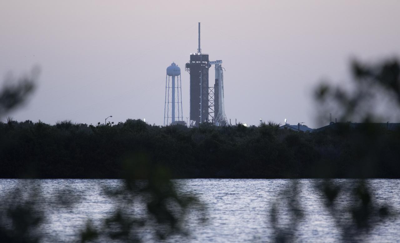 A SpaceX Falcon 9 rocket with the company's Crew Dragon spacecraft aboard is seen at sunrise on the launch pad at Launch Complex 39A as preparations continue for Axiom Mission 1 (Ax-1), Friday, April 8, 2022, at NASA’s Kennedy Space Center in Florida. The Ax-1 mission is the first private astronaut mission to the International Space Station.  Ax-1 crew members Commander Michael López-Alegría of Spain and the United States, Pilot Larry Connor of the United States, and Mission Specialists Eytan Stibbe of Israel, and Mark Pathy of Canada are scheduled to launch at 11:17 a.m. EDT from Launch Complex 39A at the Kennedy Space Center. Photo Credit: (NASA/Joel Kowsky)