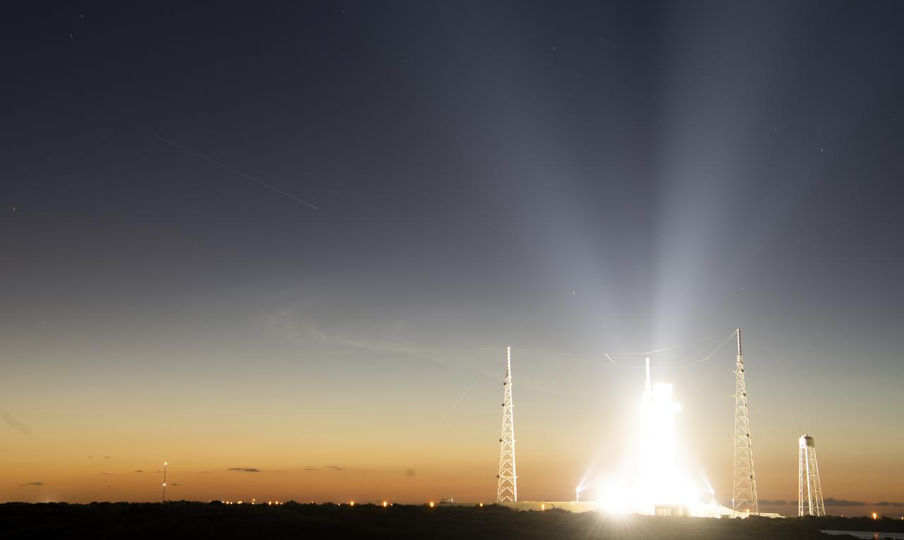 In this 30-second exposure the International Space Station is seen as it passes over NASA’s Space Launch System (SLS) rocket with the Orion spacecraft aboard atop a mobile launcher at Launch Complex 39B, Friday, April 8, 2022, as the Artemis I launch team prepares for the next attempt of the wet dress rehearsal test at NASA’s Kennedy Space Center in Florida. Onboard the space station are NASA astronauts Raja Chari, Thomas Marshburn, and Kayla Barron; ESA (European Space Agency) astronaut Matthias Maurer; and Russian cosmonauts Sergey Korsakov, Oleg Artemyev, and Denis Matveev as part of Expedition 67.  Photo Credit: (NASA/Joel Kowsky)