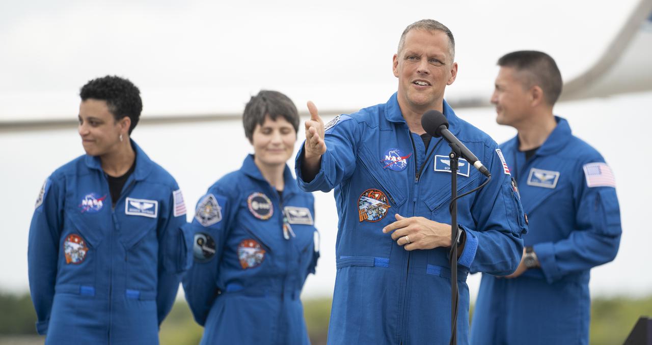 NASA astronaut Robert Hines speaks to members of the media after arriving at the Launch and Landing Facility at NASA’s Kennedy Space Center with fellow crewmates NASA astronauts Jessica Watkins, Kjell Lindgren, and ESA (European Space Agency) astronaut Samantha Cristoforetti ahead of SpaceX’s Crew-4 mission, Monday, April 18, 2022, in Florida. NASA’s SpaceX Crew-4 mission is the fourth crew rotation mission of the SpaceX Crew Dragon spacecraft and Falcon 9 rocket to the International Space Station as part of the agency’s Commercial Crew Program. Lindgren, Hines, Watkins, and Cristoforetti are scheduled to launch at April 23 at 5:26 a.m. EDT, from Launch Complex 39A at the Kennedy Space Center. Photo Credit: (NASA/Joel Kowsky)