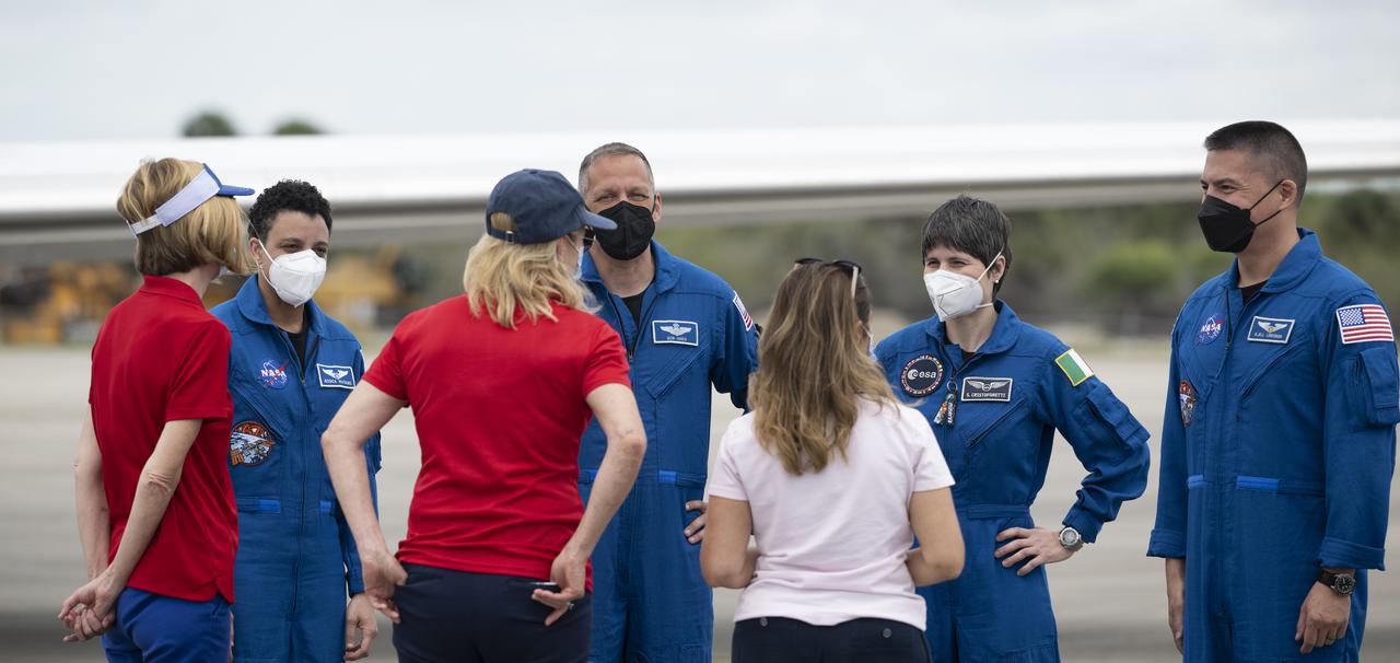 NASA astronauts Jessica Watkins, Robert Hines, ESA (European Space Agency) astronaut Samantha Cristoforetti, and NASA astronaut Kjell Lindgren, are seen with Kathy Lueders, associate administrator for NASA's Space Operations Mission Directorate, Kennedy Space Center director Janet Petro, and Barbara Nucera, ESA (European Space Agency) Houston Team Leader, after arriving at the Launch and Landing Facility at NASA’s Kennedy Space Center ahead of SpaceX’s Crew-4 mission, Monday, April 18, 2022, in Florida. NASA’s SpaceX Crew-4 mission is the fourth crew rotation mission of the SpaceX Crew Dragon spacecraft and Falcon 9 rocket to the International Space Station as part of the agency’s Commercial Crew Program. Lindgren, Hines, Watkins, and Cristoforetti are scheduled to launch at April 23 at 5:26 a.m. EDT, from Launch Complex 39A at the Kennedy Space Center. Photo Credit: (NASA/Joel Kowsky)