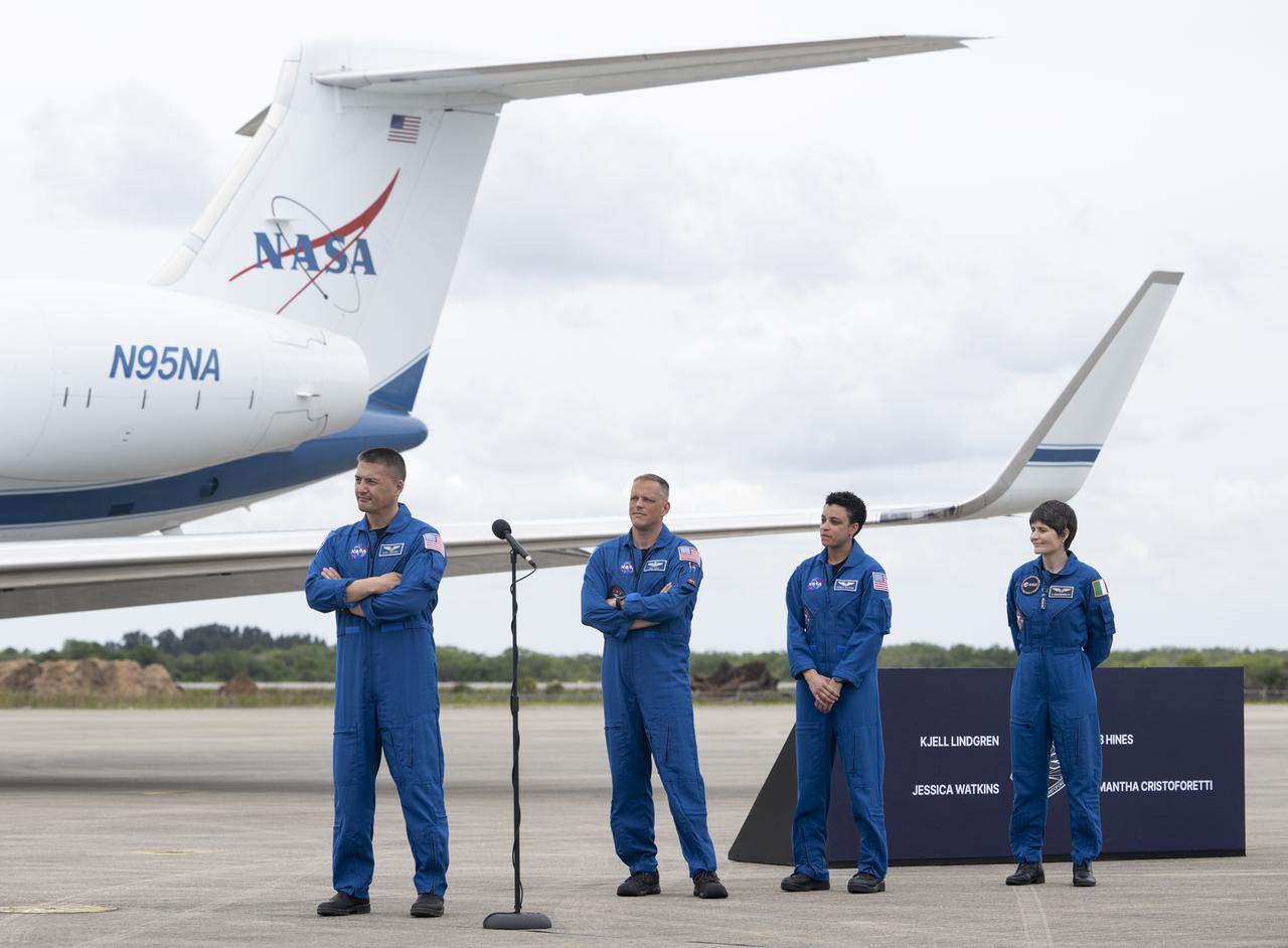 NASA astronauts Kjell Lindgren, left, Robert Hines, second from left, Jessica Watkins, second from right, and ESA (European Space Agency) astronaut Samantha Cristoforetti, right, are seen after arriving at the Launch and Landing Facility at NASA’s Kennedy Space Center ahead of SpaceX’s Crew-4 mission, Monday, April 18, 2022, in Florida. NASA’s SpaceX Crew-4 mission is the fourth crew rotation mission of the SpaceX Crew Dragon spacecraft and Falcon 9 rocket to the International Space Station as part of the agency’s Commercial Crew Program. Lindgren, Hines, Watkins, and Cristoforetti are scheduled to launch at April 23 at 5:26 a.m. EDT, from Launch Complex 39A at the Kennedy Space Center. Photo Credit: (NASA/Joel Kowsky)