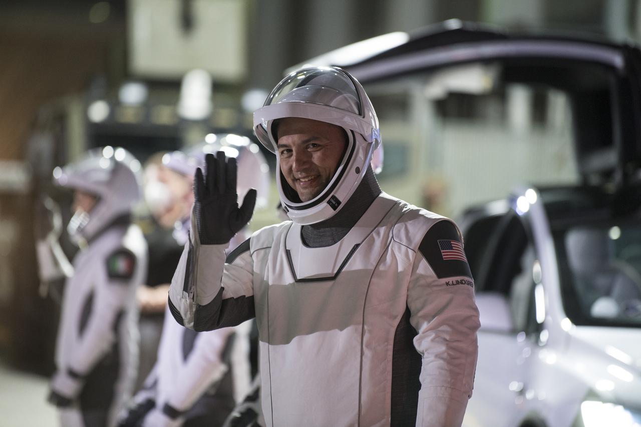 NASA astronaut Kjell Lindgren waves as he and crew mates NASA astronauts Robert Hines, Jessica Watkins, and ESA (European Space Agency) astronaut Samantha Cristoforetti, wearing SpaceX spacesuits, prepare to depart the Neil  A. Armstrong Operations and Checkout Building for Launch Complex 39A during a dress rehearsal prior to the Crew-4 mission launch, Wednesday, April 20, 2022, at NASA’s Kennedy Space Center in Florida. NASA’s SpaceX Crew-4 mission is the fourth crew rotation mission of the SpaceX Crew Dragon spacecraft and Falcon 9 rocket to the International Space Station as part of the agency’s Commercial Crew Program. Lindgren, Hines, Watkins, and Cristoforetti are scheduled to launch on April 23 at 5:26 a.m. EDT, from Launch Complex 39A at the Kennedy Space Center. Photo Credit: (NASA/Aubrey Gemignani)