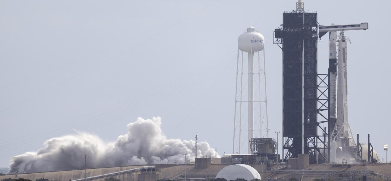 A SpaceX Falcon 9 rocket with the company's Crew Dragon spacecraft onboard is seen on the launch pad at Launch Complex 39A during a brief static fire test ahead of NASA’s SpaceX Crew-4 mission, Wednesday, April 20, 2022, at NASA’s Kennedy Space Center in Florida. NASA’s SpaceX Crew-4 mission is the fourth crew rotation mission of the SpaceX Crew Dragon spacecraft and Falcon 9 rocket to the International Space Station as part of the agency’s Commercial Crew Program. NASA astronauts Kjell Lindgren, Robert Hines, Jessica Watkins, and ESA (European Space Agency) astronaut Samantha Cristoforetti are scheduled to launch on April 23 at 5:26 a.m. EDT, from Launch Complex 39A at the Kennedy Space Center. Photo Credit: (NASA/Joel Kowsky)