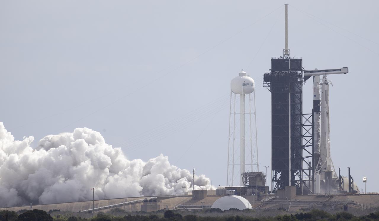 A SpaceX Falcon 9 rocket with the company's Crew Dragon spacecraft onboard is seen on the launch pad at Launch Complex 39A during a brief static fire test ahead of NASA’s SpaceX Crew-4 mission, Wednesday, April 20, 2022, at NASA’s Kennedy Space Center in Florida. NASA’s SpaceX Crew-4 mission is the fourth crew rotation mission of the SpaceX Crew Dragon spacecraft and Falcon 9 rocket to the International Space Station as part of the agency’s Commercial Crew Program. NASA astronauts Kjell Lindgren, Robert Hines, Jessica Watkins, and ESA (European Space Agency) astronaut Samantha Cristoforetti are scheduled to launch on April 23 at 5:26 a.m. EDT, from Launch Complex 39A at the Kennedy Space Center. Photo Credit: (NASA/Joel Kowsky)