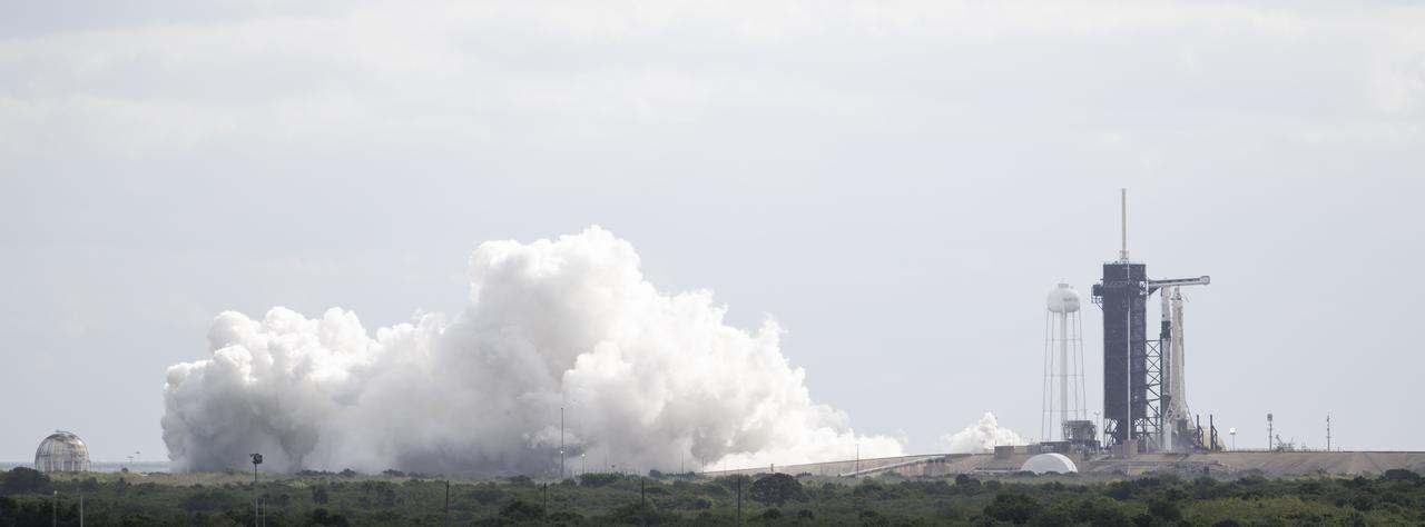 A SpaceX Falcon 9 rocket with the company's Crew Dragon spacecraft onboard is seen on the launch pad at Launch Complex 39A during a brief static fire test ahead of NASA’s SpaceX Crew-4 mission, Wednesday, April 20, 2022, at NASA’s Kennedy Space Center in Florida. NASA’s SpaceX Crew-4 mission is the fourth crew rotation mission of the SpaceX Crew Dragon spacecraft and Falcon 9 rocket to the International Space Station as part of the agency’s Commercial Crew Program. NASA astronauts Kjell Lindgren, Robert Hines, Jessica Watkins, and ESA (European Space Agency) astronaut Samantha Cristoforetti are scheduled to launch on April 23 at 5:26 a.m. EDT, from Launch Complex 39A at the Kennedy Space Center. Photo Credit: (NASA/Joel Kowsky)
