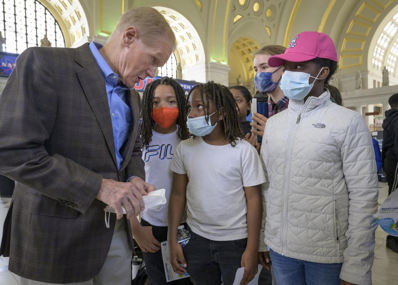 NASA Administrator Bill Nelson, left, talks with DC area school children about Earth Day during his visit of NASA hands-on exhibits inside Union Station in Washington, Friday, April 22, 2022. Photo Credit: (NASA/Bill Ingalls)