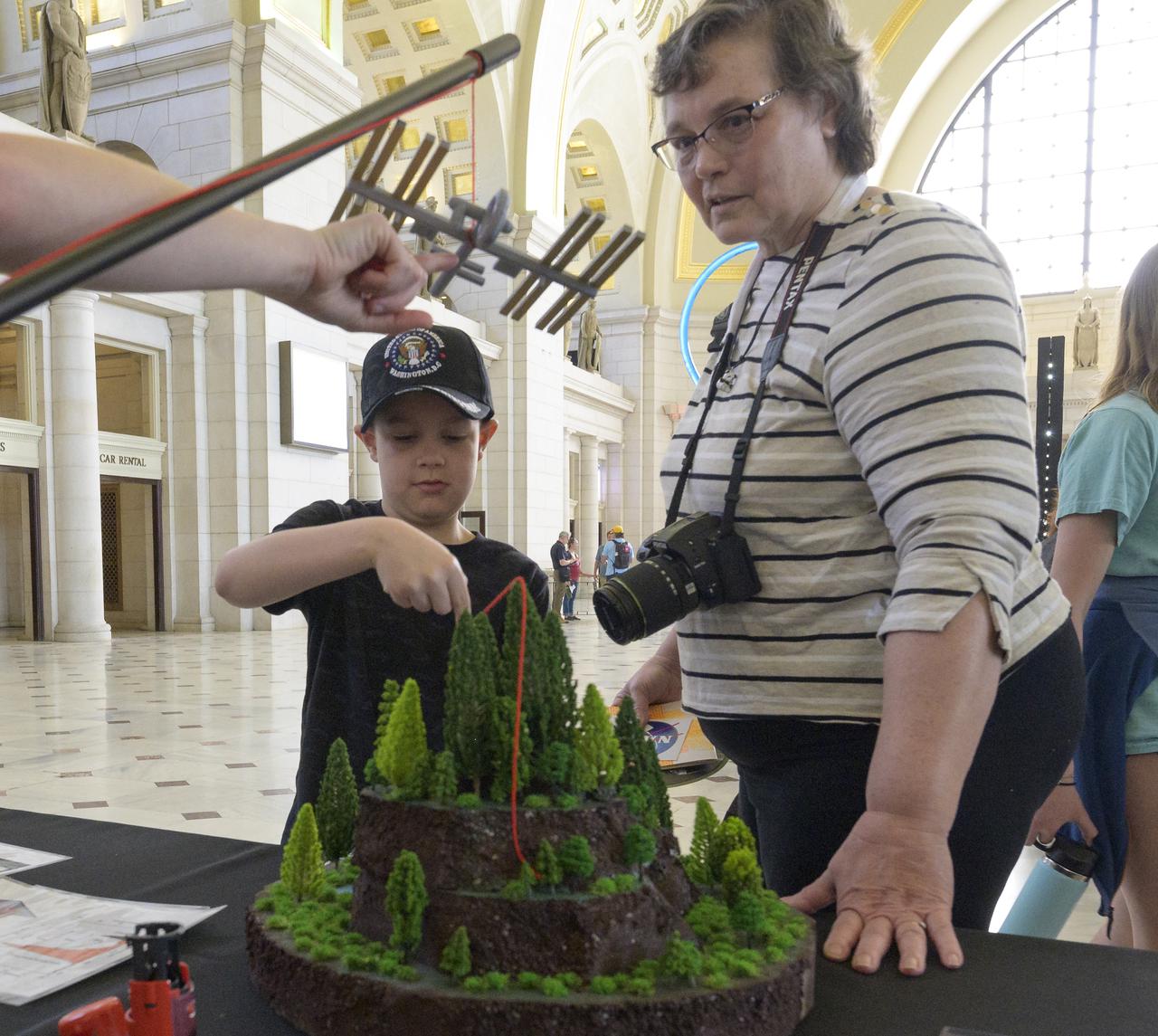 Visitors explore NASA’s hands-on exhibits during Earth Day, Friday, April 22, 2022, at Union Station in Washington. Photo Credit: (NASA/Bill Ingalls)